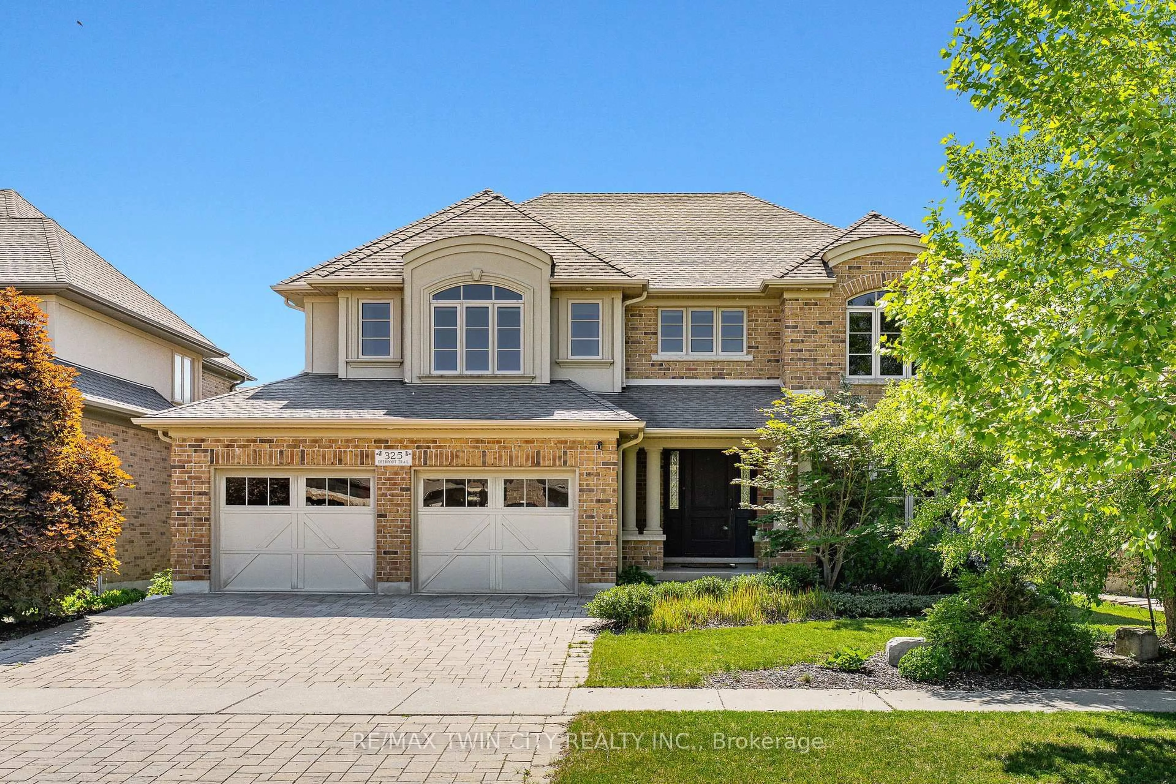 Home with brick exterior material, street for 325 Deerfoot Tr, Waterloo Ontario N2K 0B4
