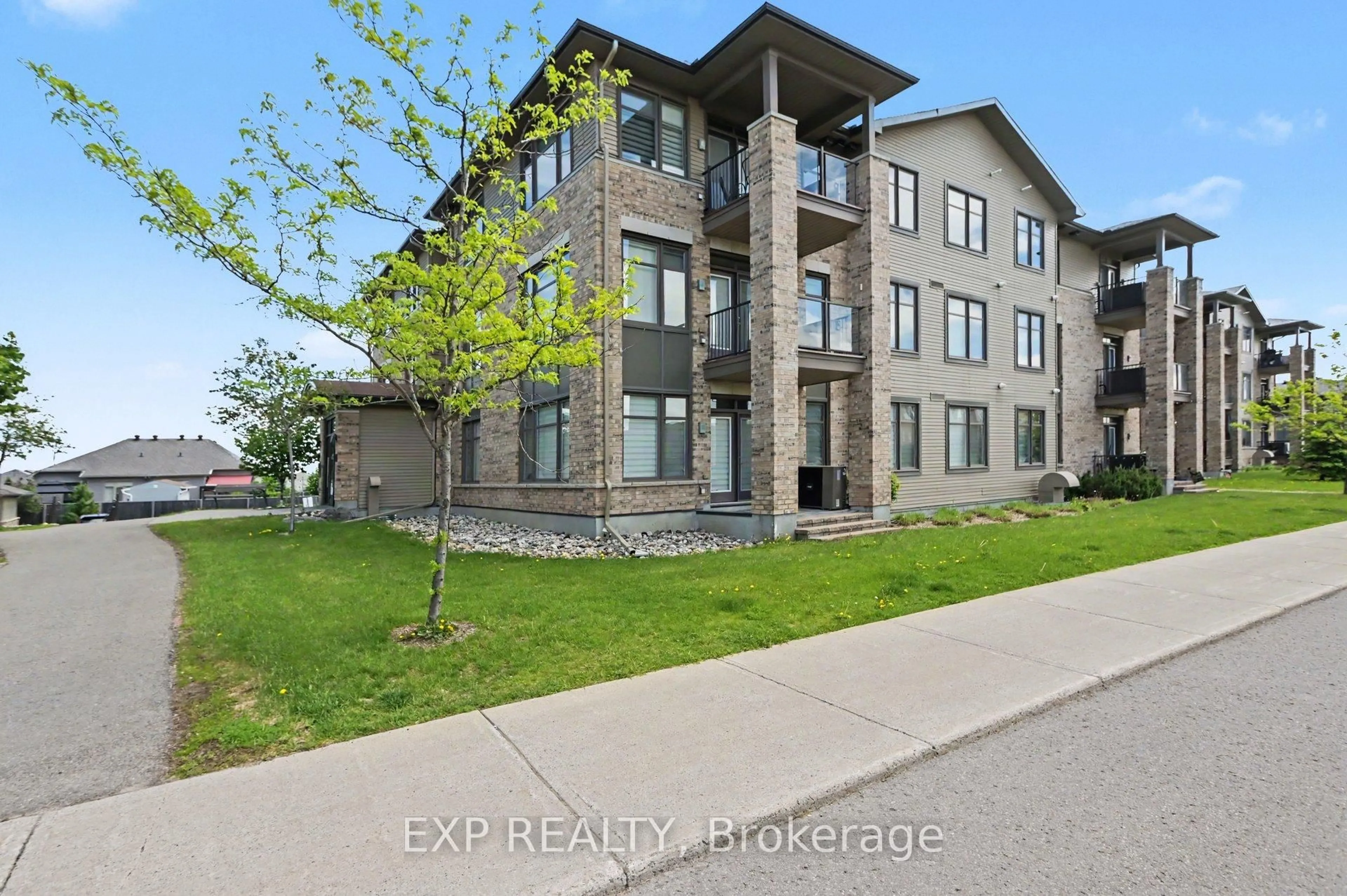 A pic from outside/outdoor area/front of a property/back of a property/a pic from drone, building for 310 Jatoba Private #301, Ottawa Ontario K2V 0E7