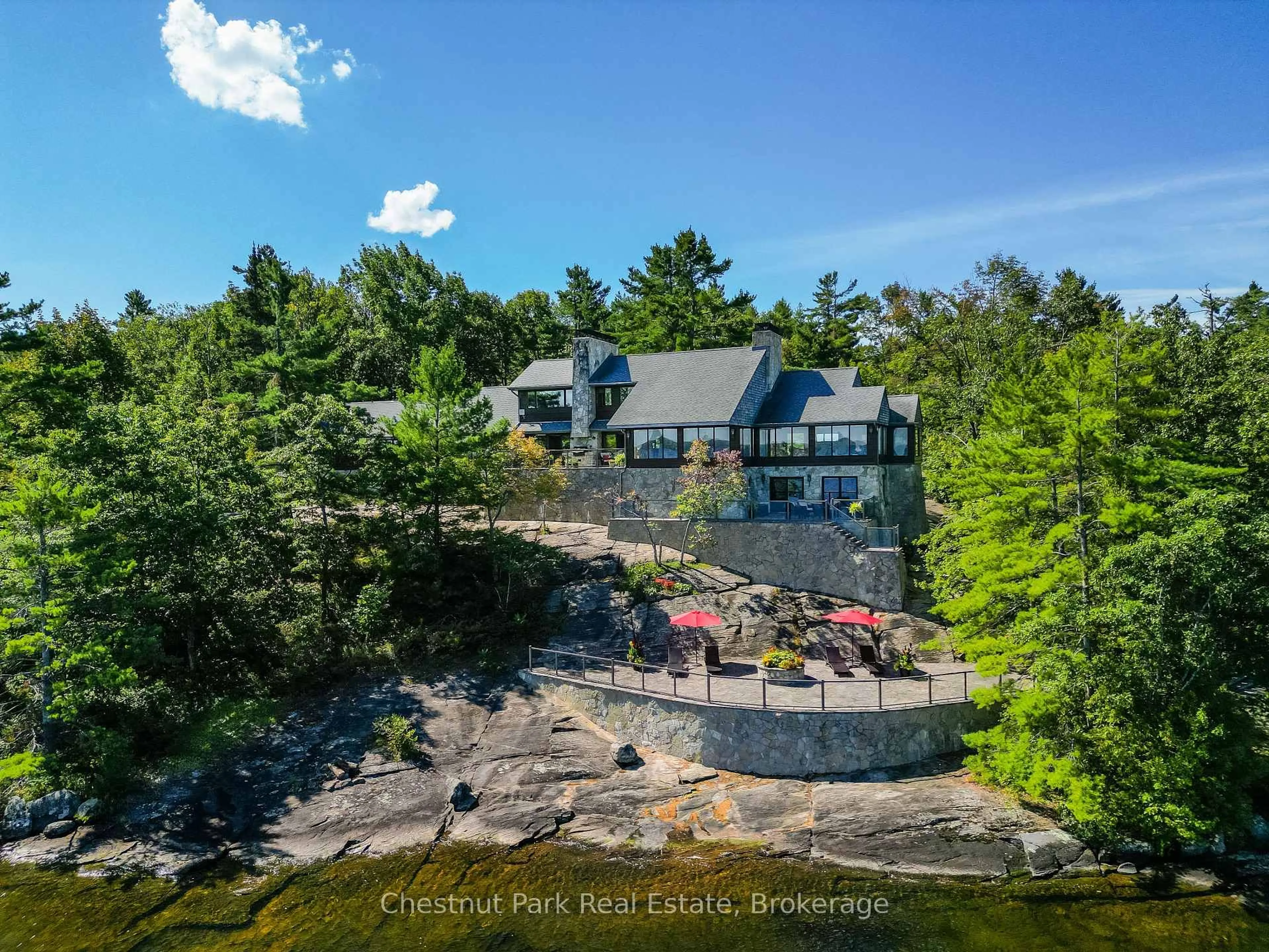 A pic from outside/outdoor area/front of a property/back of a property/a pic from drone, water/lake/river/ocean view for 1088 Lawland Heights Rd #2, Gravenhurst Ontario P1P 1R2