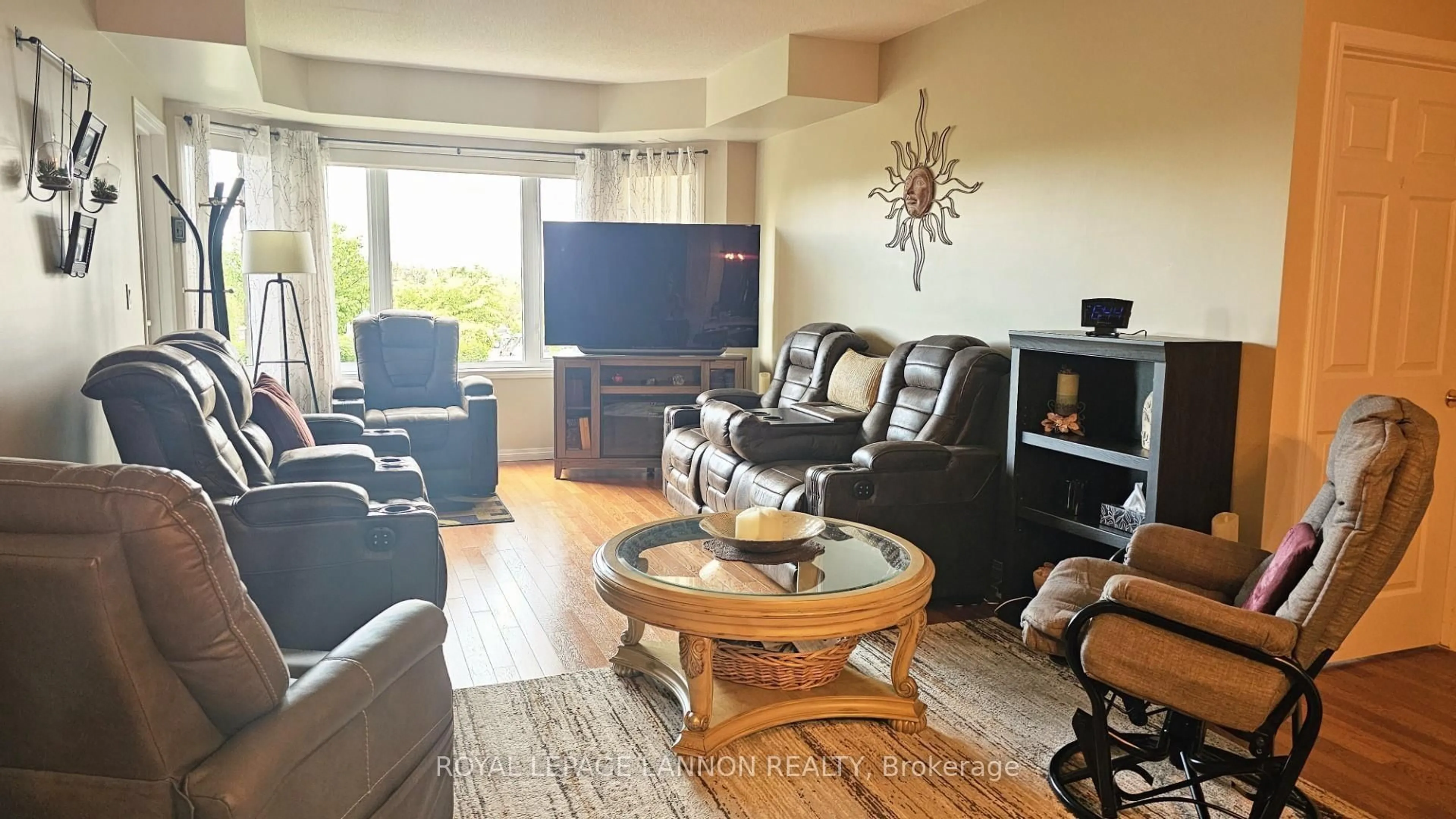 Living room with furniture, wood/laminate floor for 315 Hilldale Road ##112, Thunder Bay Ontario P7G 1J7