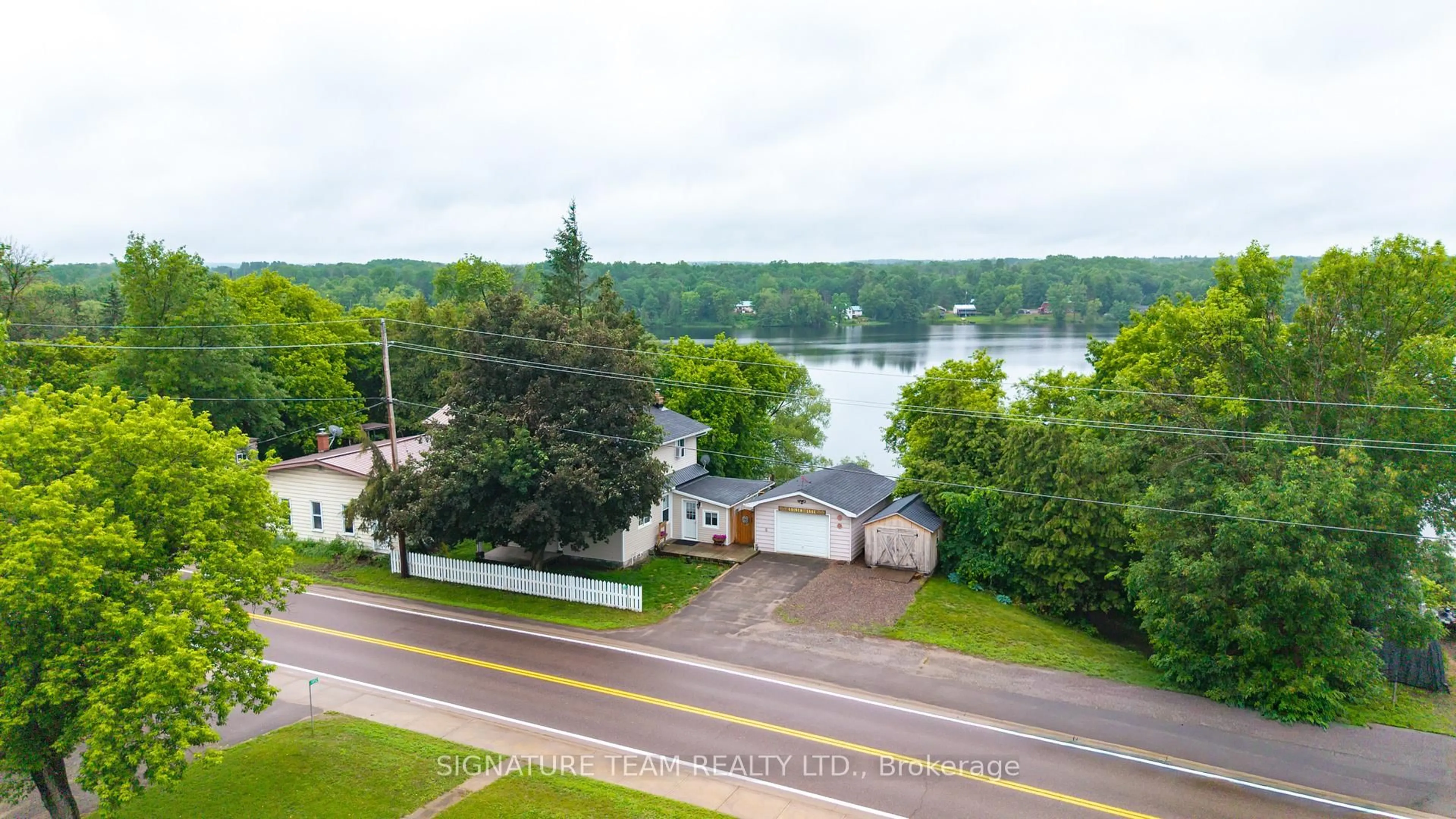 A pic from outside/outdoor area/front of a property/back of a property/a pic from drone, water/lake/river/ocean view for 11153 60 Highway, Golden Lake Ontario K0J 1X0