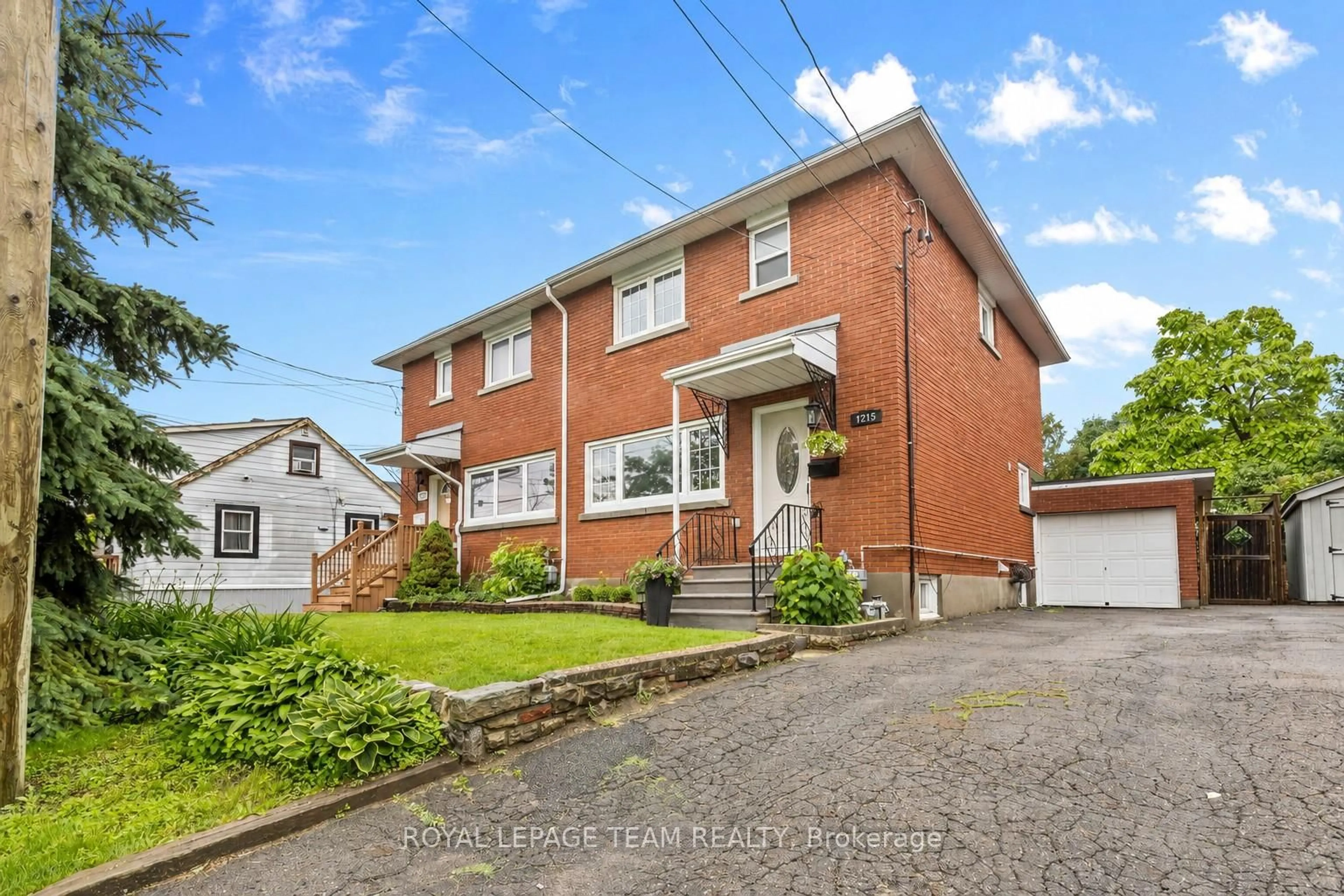 Home with brick exterior material, street for 1215 Emperor Ave, Ottawa Ontario K1Z 8C3