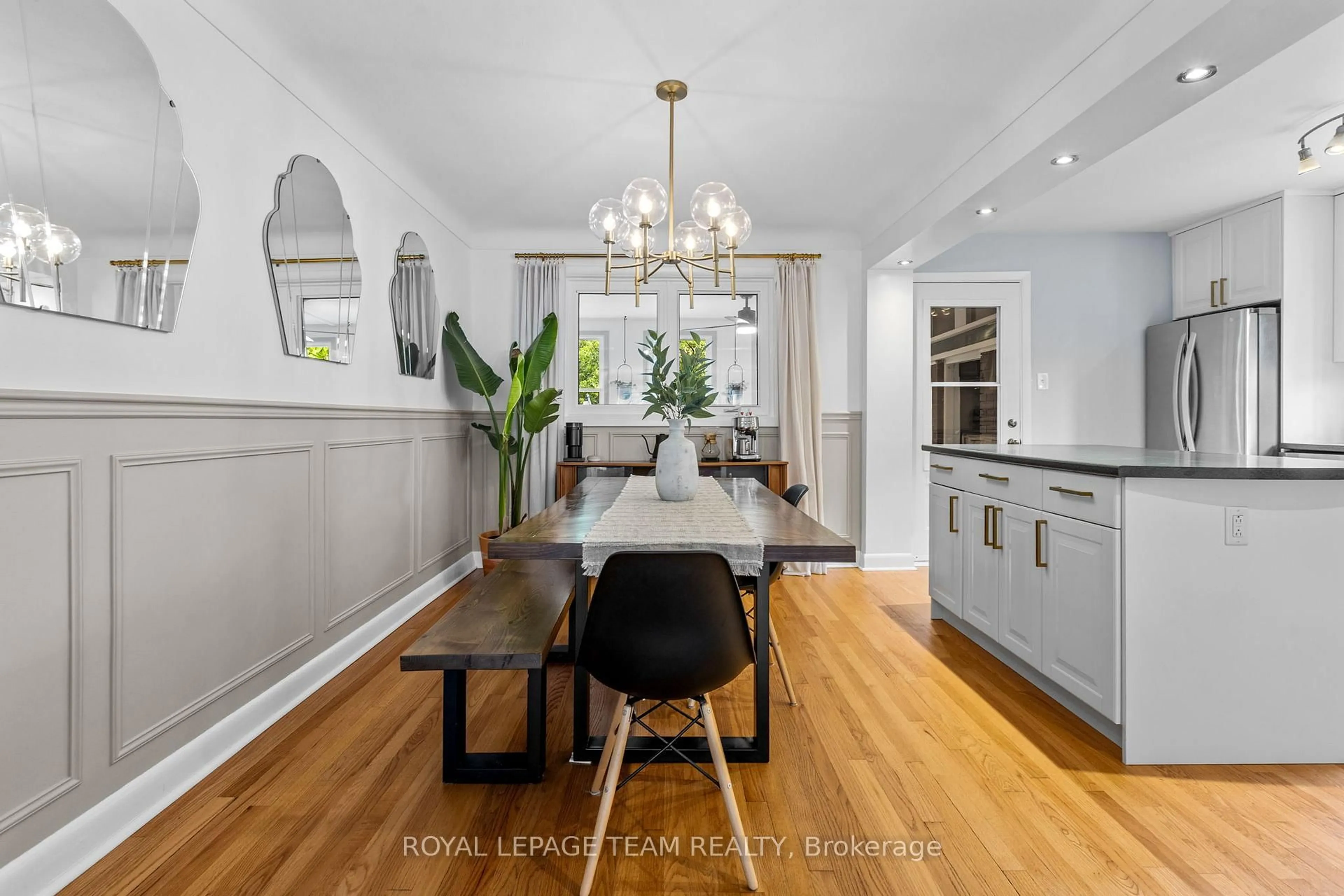 Open concept kitchen, wood/laminate floor for 1215 Emperor Ave, Ottawa Ontario K1Z 8C3