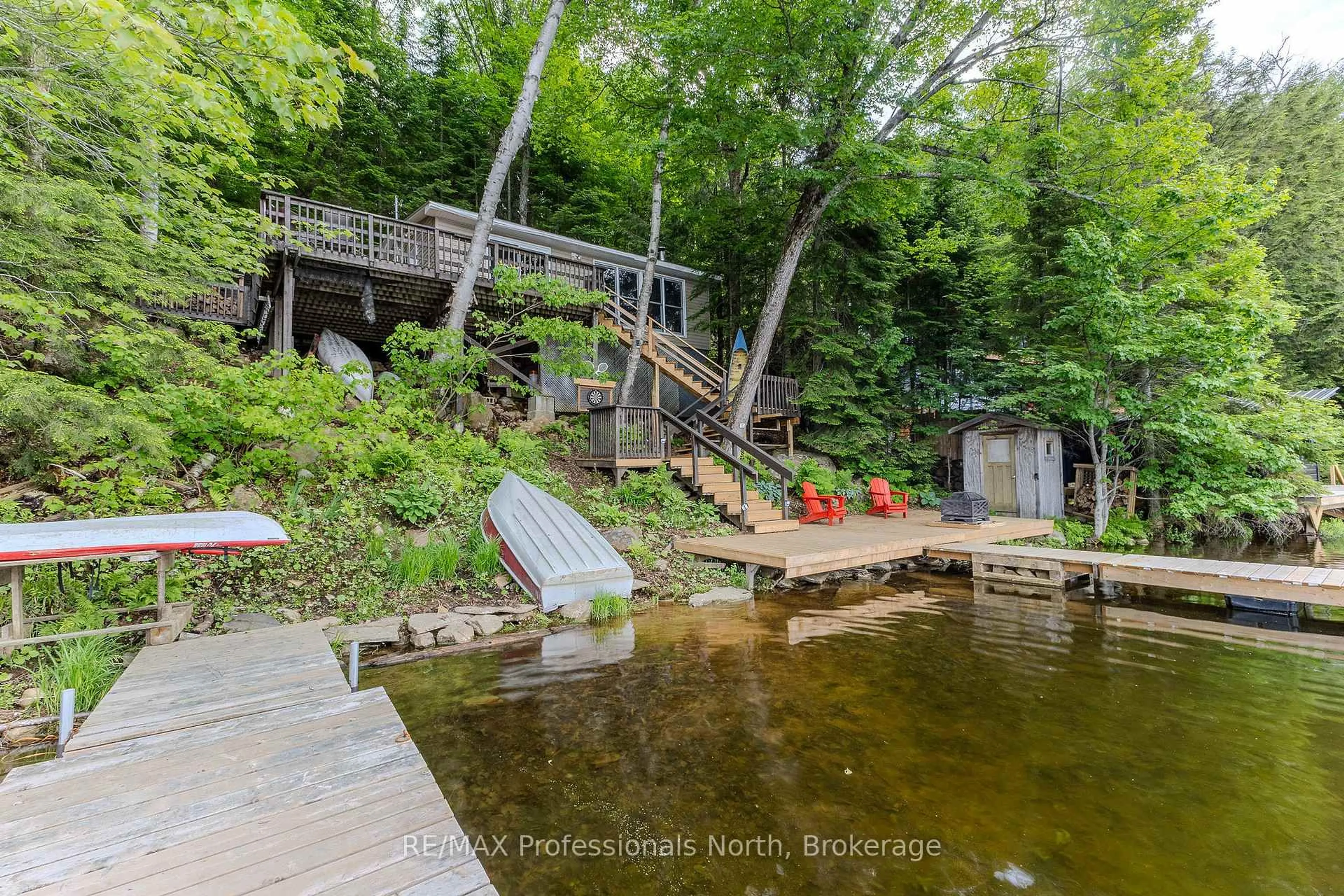 A pic from outside/outdoor area/front of a property/back of a property/a pic from drone, water/lake/river/ocean view for 1016 TWILIGHT Clse, Algonquin Highlands Ontario P0A 1E0