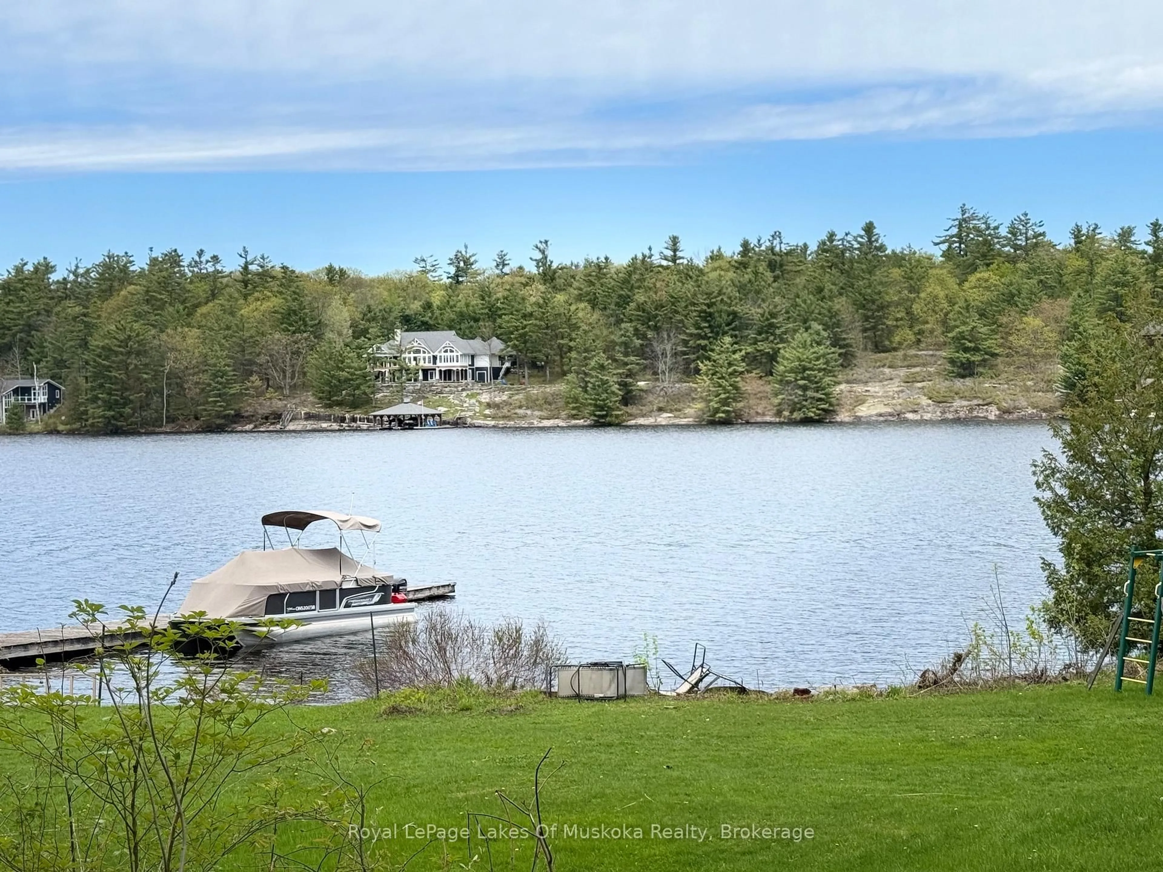 A pic from outside/outdoor area/front of a property/back of a property/a pic from drone, water/lake/river/ocean view for 180 Two Rd #2, Gravenhurst Ontario P1P 1R1
