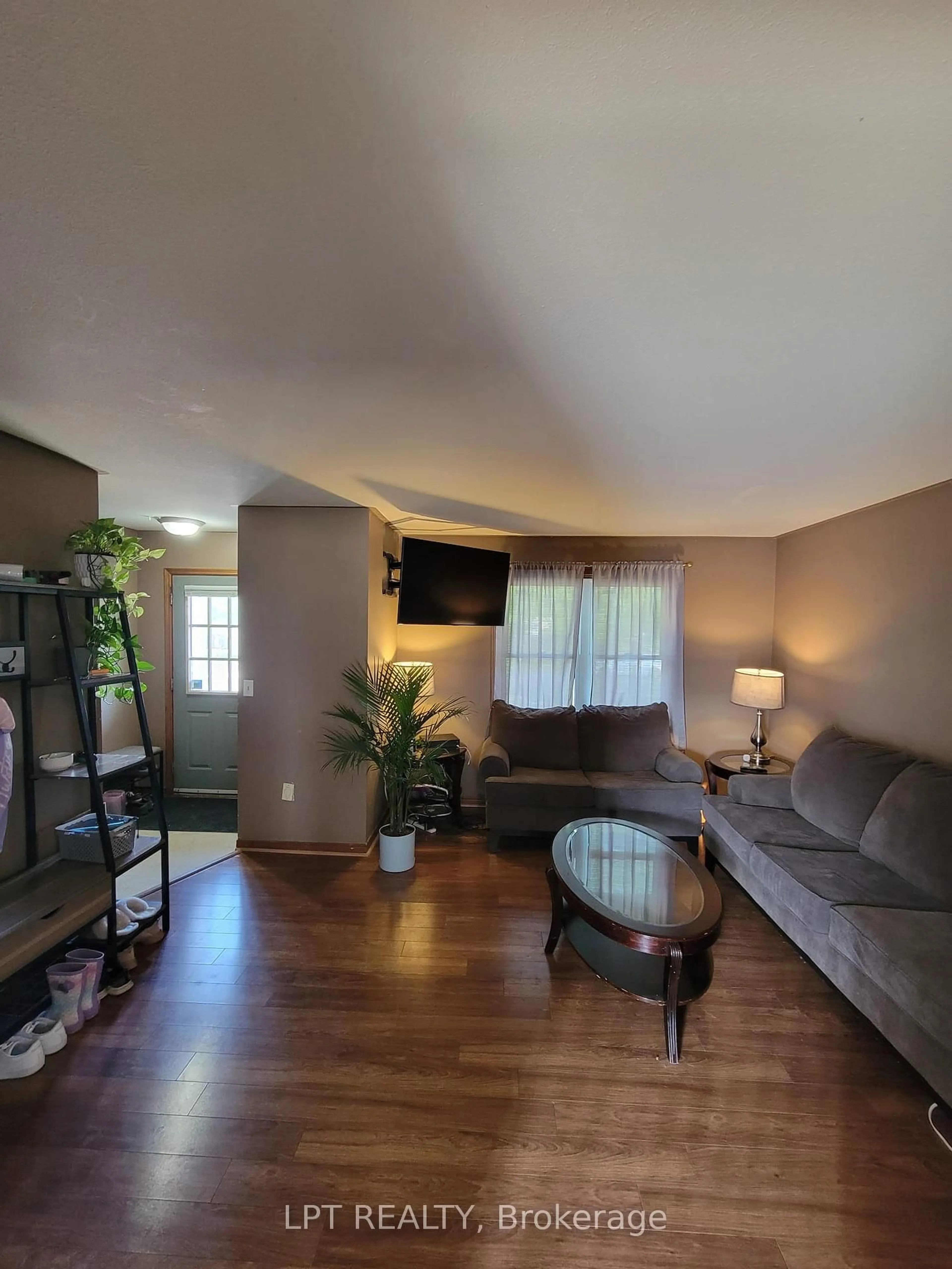 Living room with furniture, wood/laminate floor for 57 Poplar Cres, Welland Ontario L3C 6W2