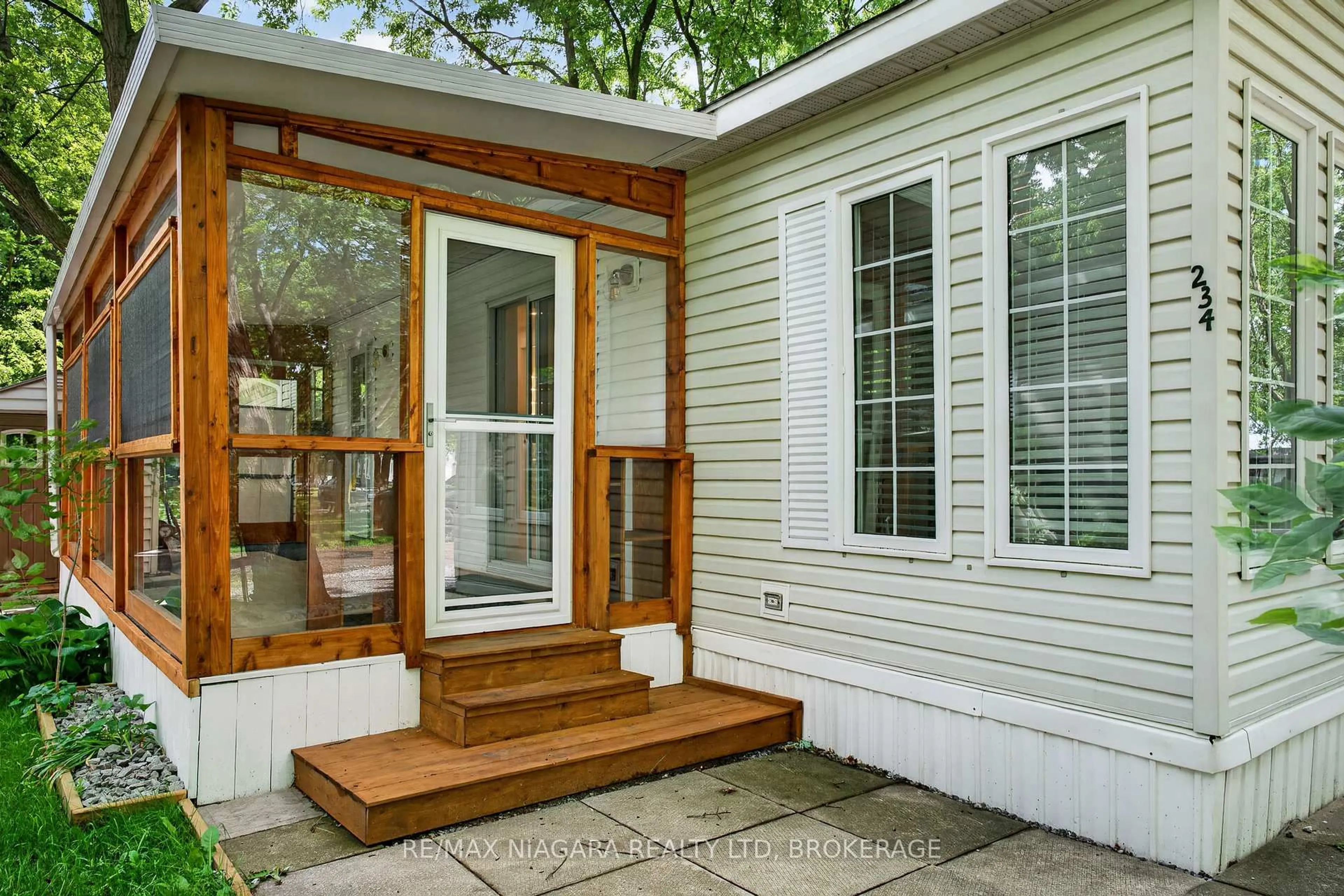 Home with vinyl exterior material, street for 8845 Lundys Lane #234, Niagara Falls Ontario L2H 1H5
