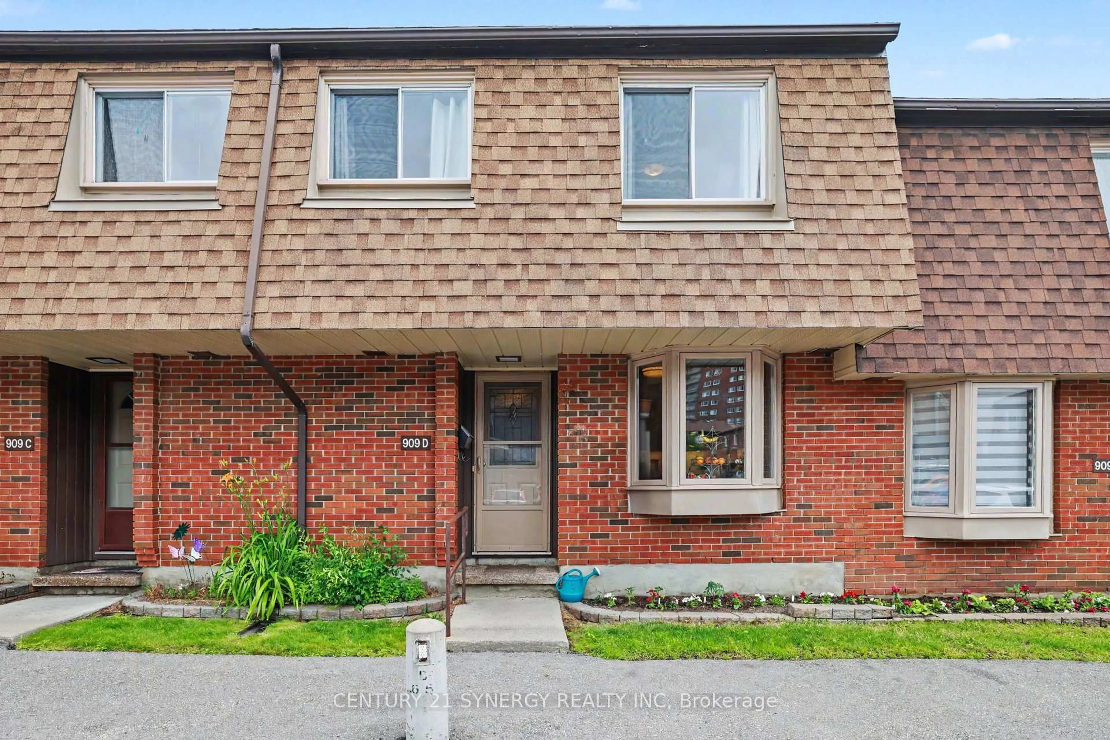 Home with brick exterior material, street for 909D Elmsmere Rd #152, Ottawa Ontario K1J 8G4