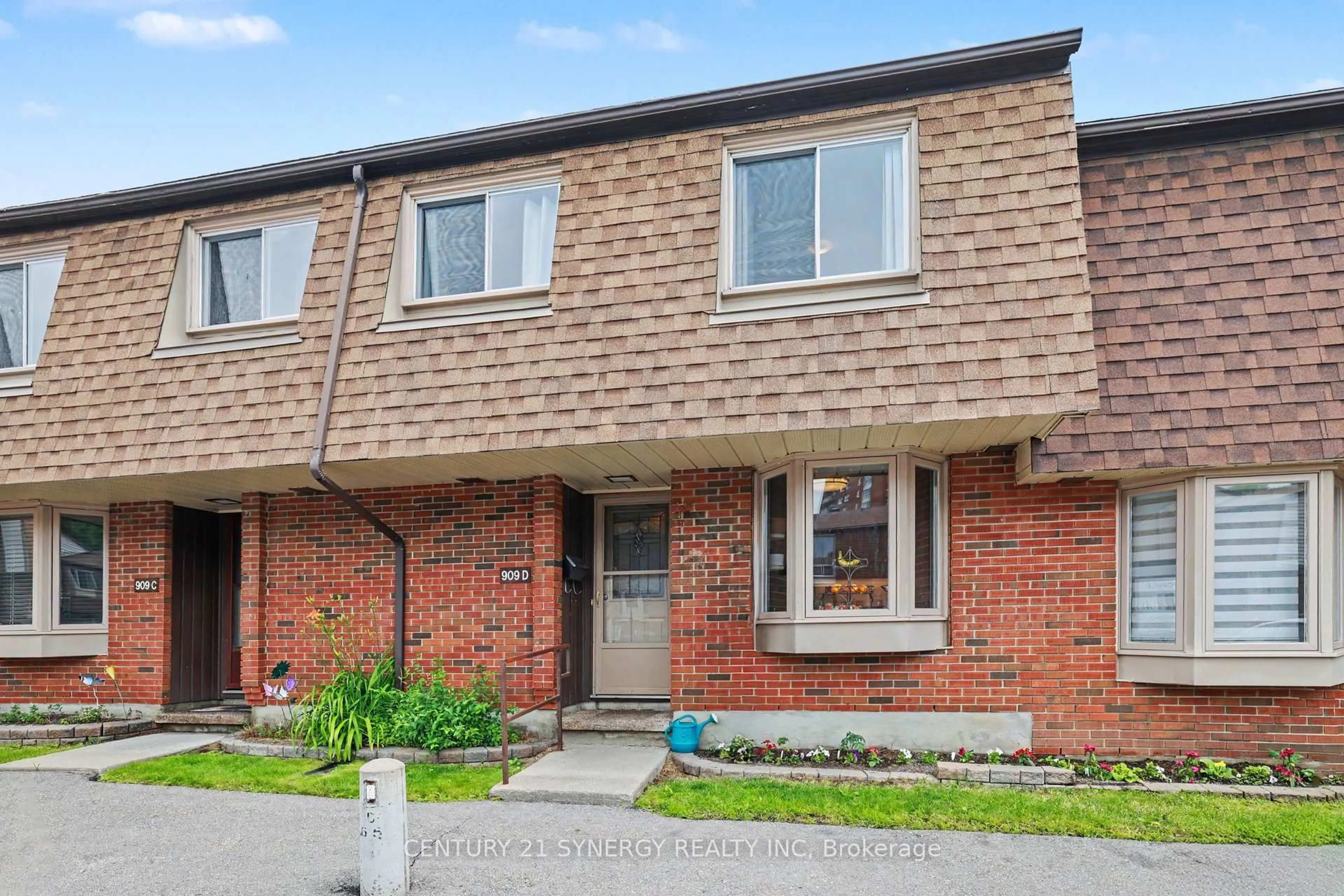 Home with brick exterior material, street for 909D Elmsmere Rd #152, Ottawa Ontario K1J 8G4