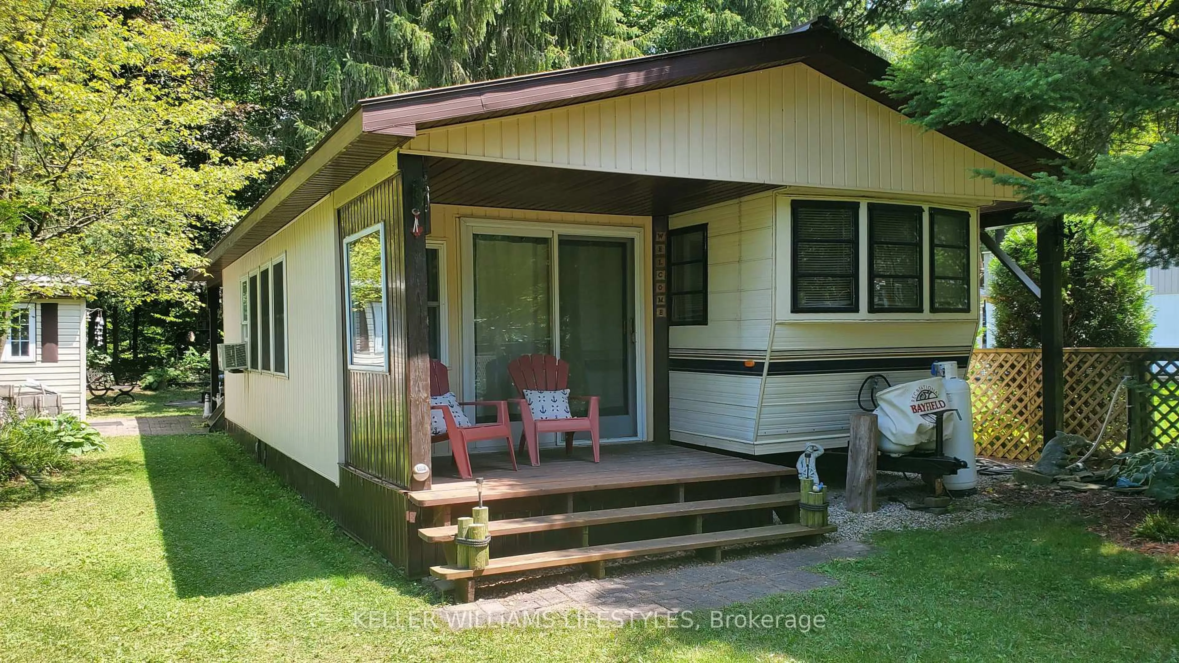 Home with vinyl exterior material, street for 76735 Wildwood Line #425, Bluewater Ontario N0M 1G0