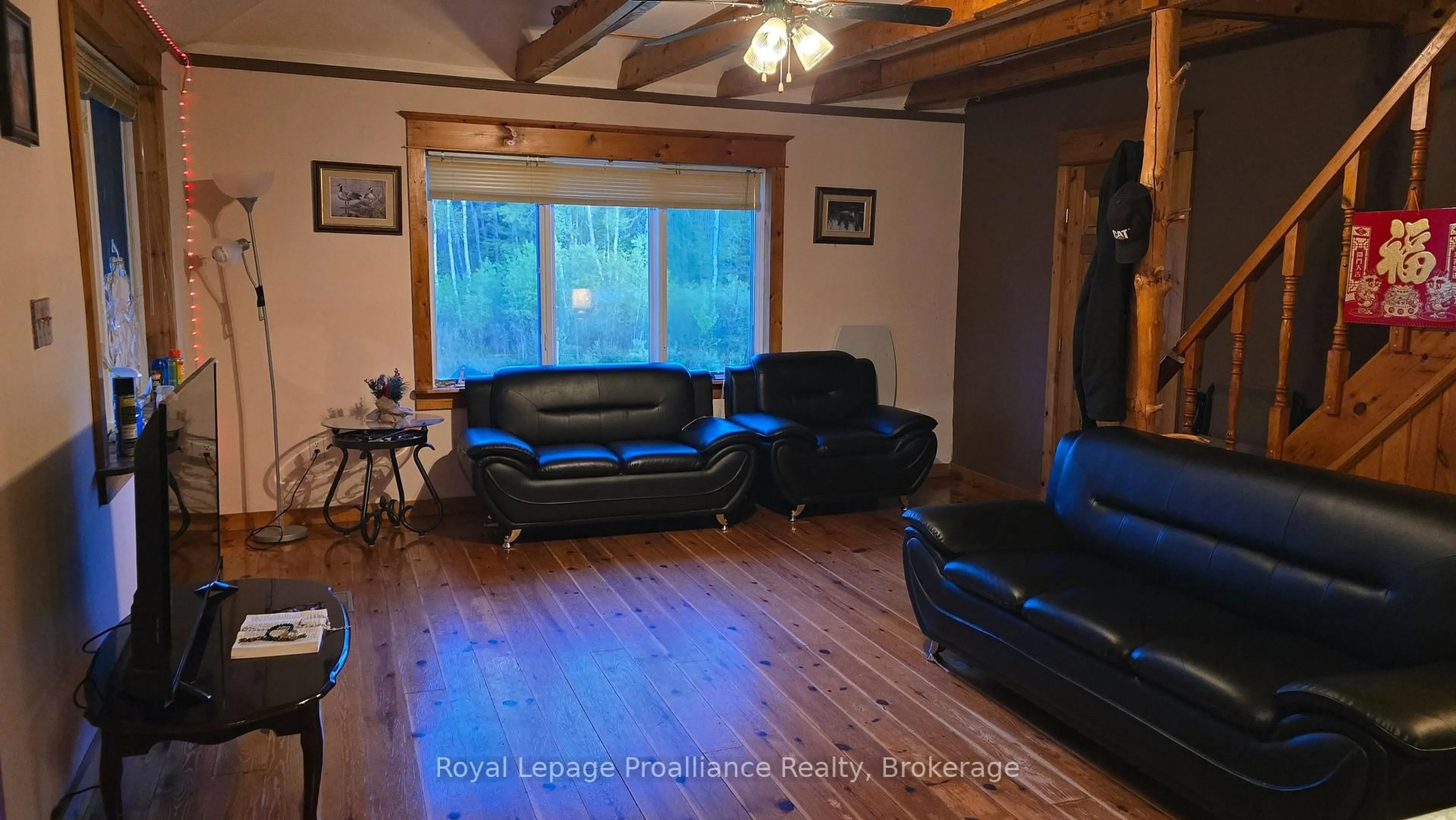 Living room with furniture, wood/laminate floor for 276 5th Concession Rd, Kaladar Ontario K0H 1P0