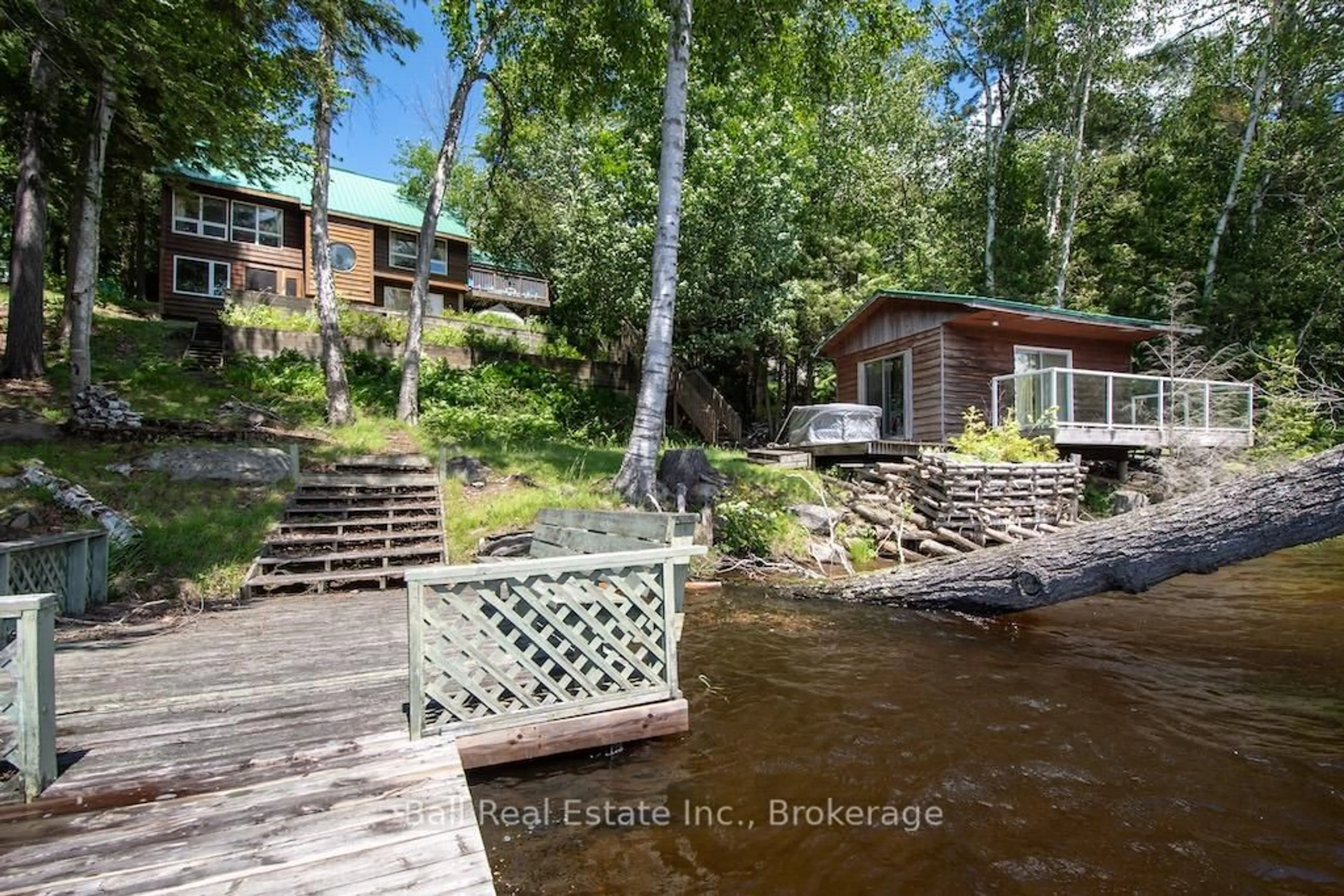 A pic from outside/outdoor area/front of a property/back of a property/a pic from drone, water/lake/river/ocean view for 65 Fire Route 213, Trent Lakes Ontario K0L 1J0