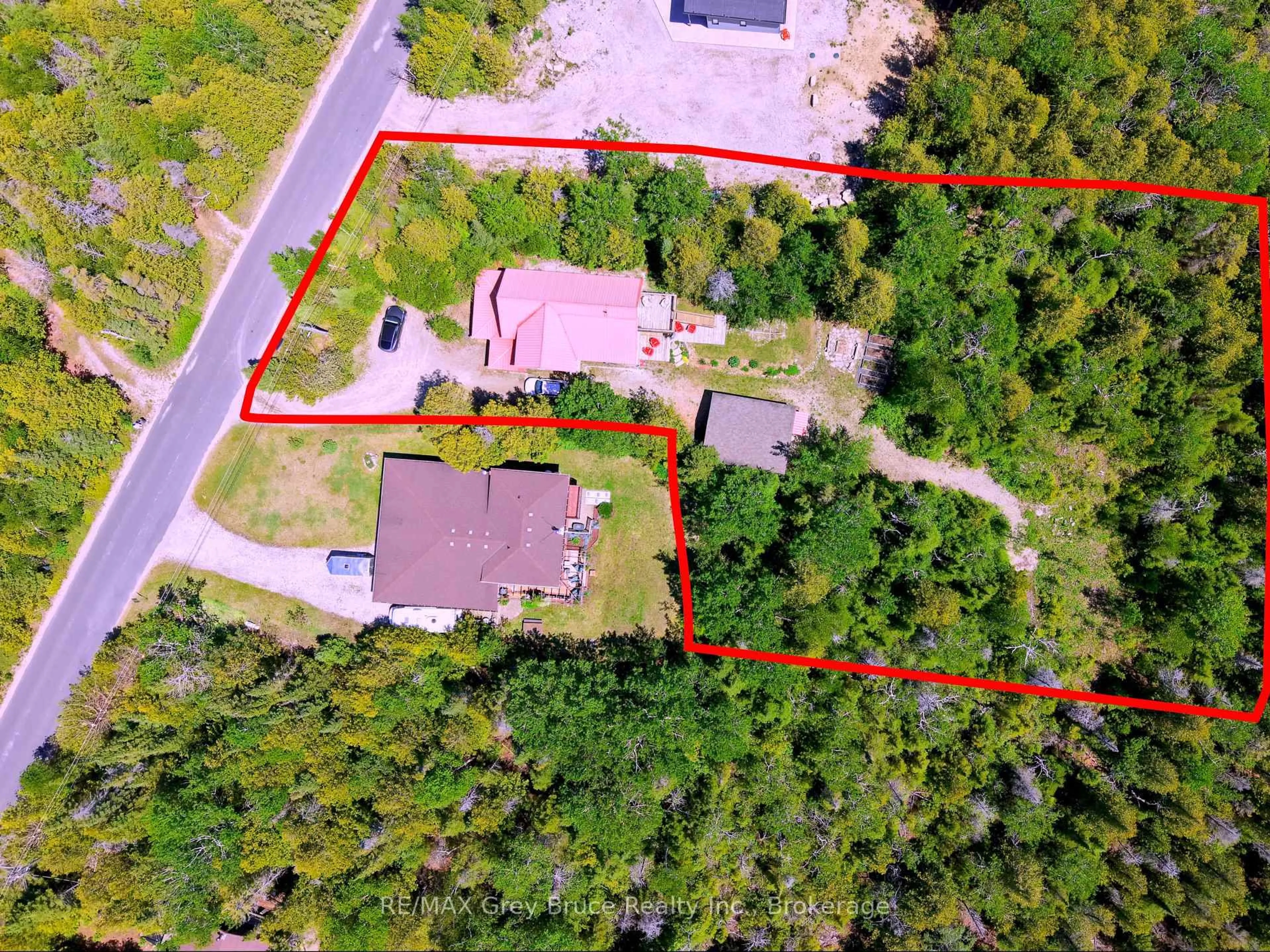 A pic from outside/outdoor area/front of a property/back of a property/a pic from drone, street for 67 Big Tub Rd, Northern Bruce Peninsula Ontario N0H 2R0