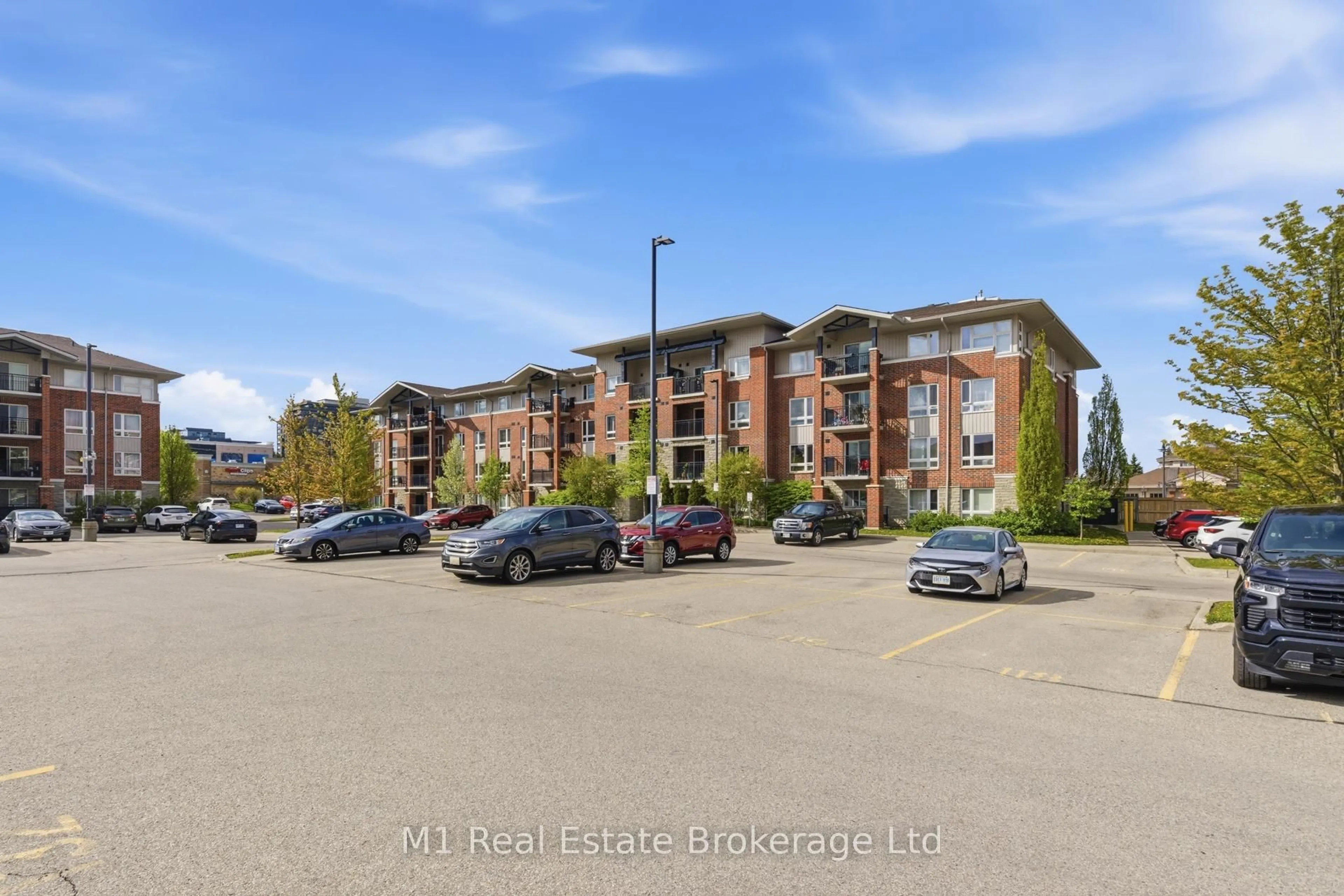 A pic from outside/outdoor area/front of a property/back of a property/a pic from drone, unknown for 45 Goodwin Dr #311, Guelph Ontario N1L 0E9