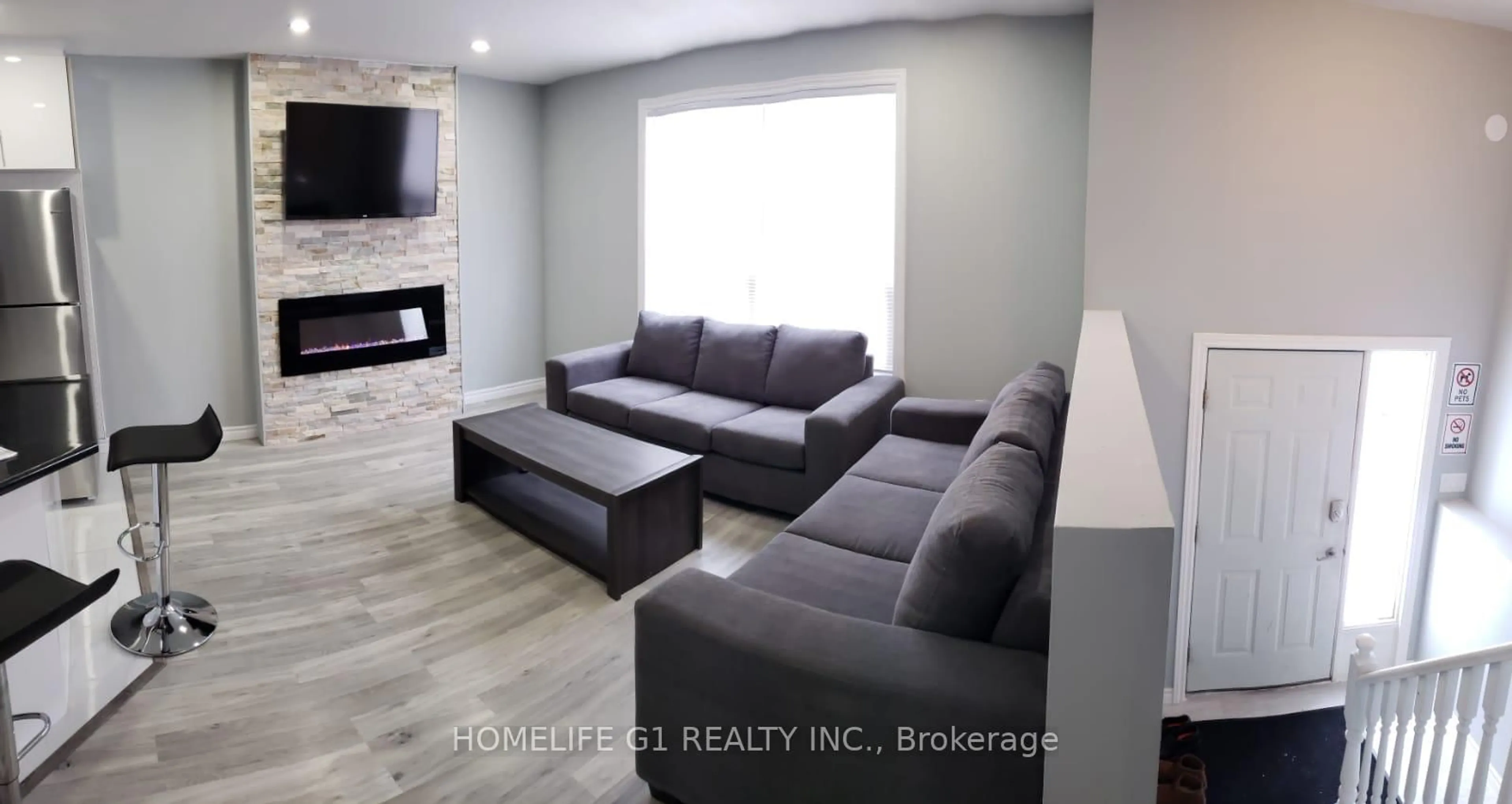 Living room with furniture, wood/laminate floor for 137 Columbia Ave, London North Ontario N6H 2K3