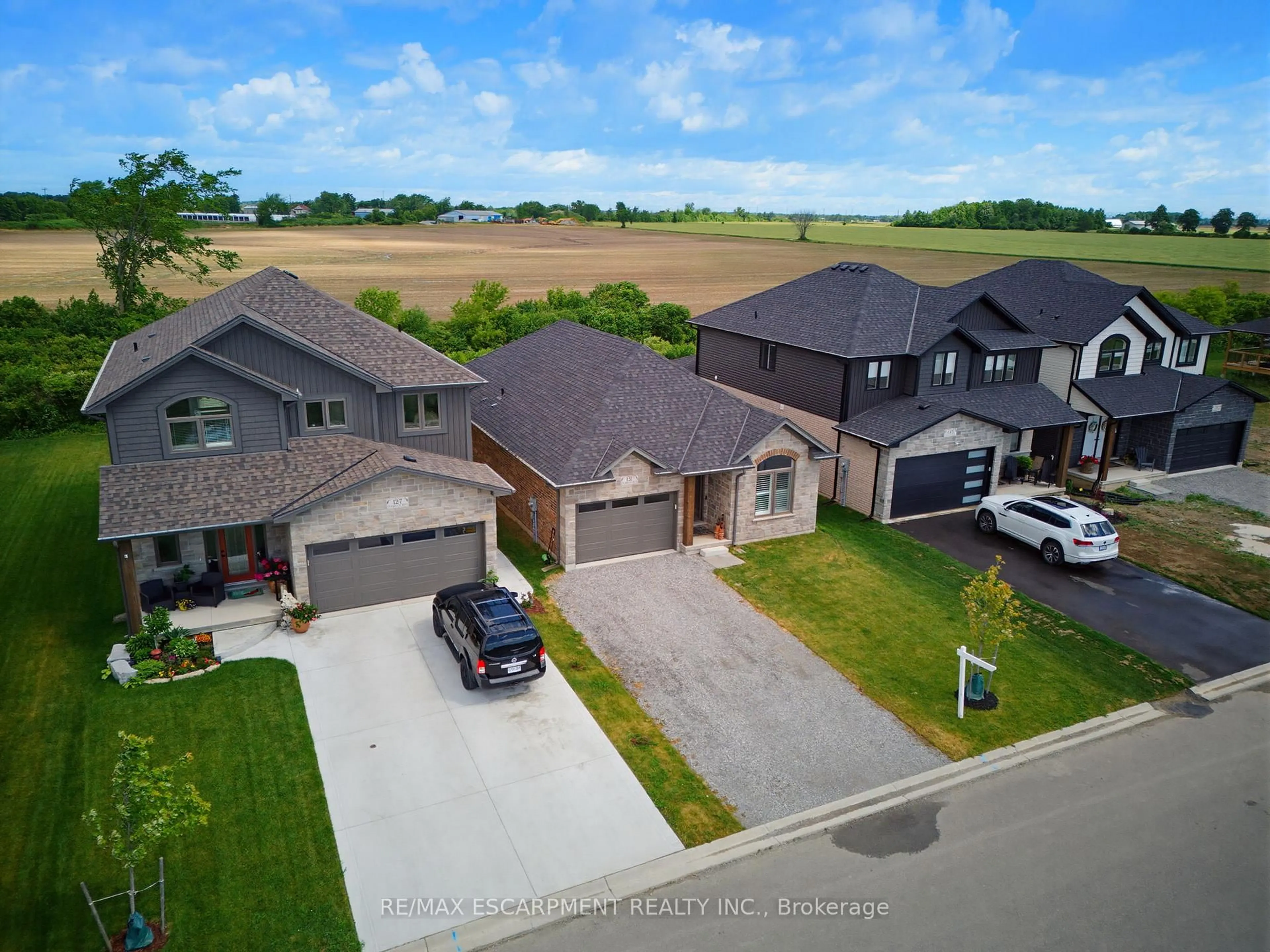 A pic from outside/outdoor area/front of a property/back of a property/a pic from drone, street for 131 Craddock Blvd, Haldimand Ontario N0A 1J0