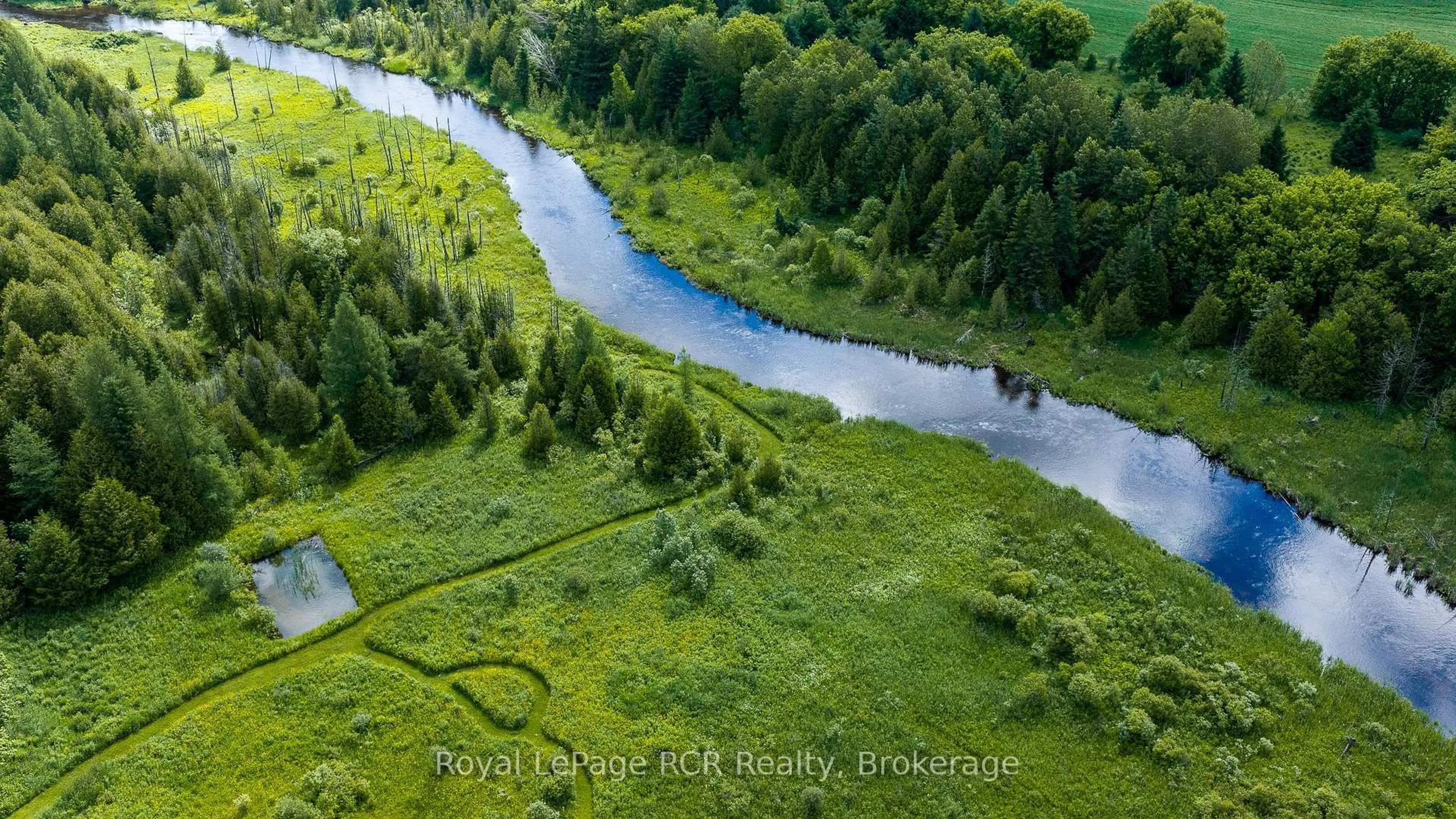 A pic from outside/outdoor area/front of a property/back of a property/a pic from drone, water/lake/river/ocean view for 775355 Highway 10, Grey Highlands Ontario N0C 1H0