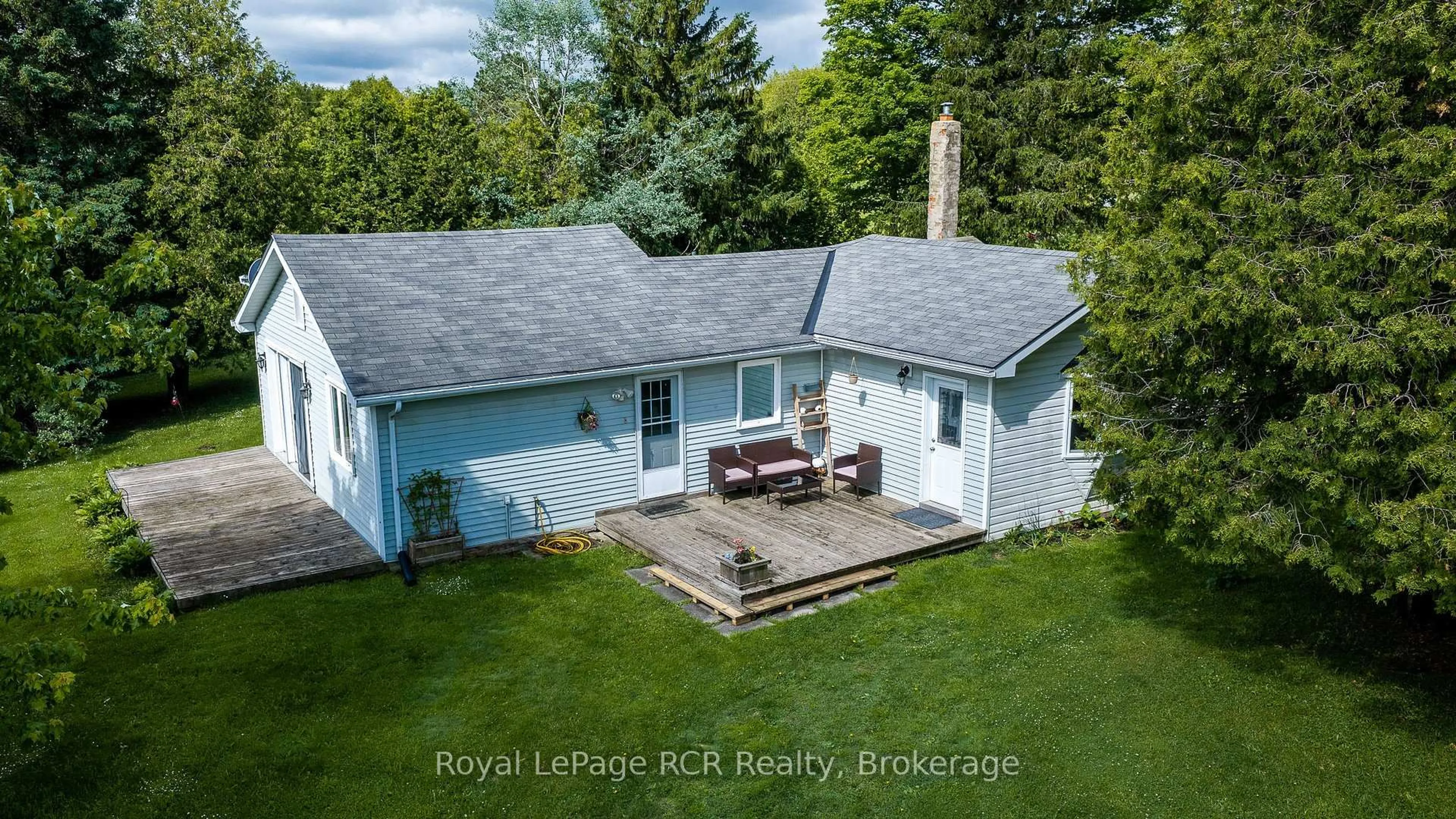 A pic from outside/outdoor area/front of a property/back of a property/a pic from drone, water/lake/river/ocean view for 775355 Highway 10, Grey Highlands Ontario N0C 1H0