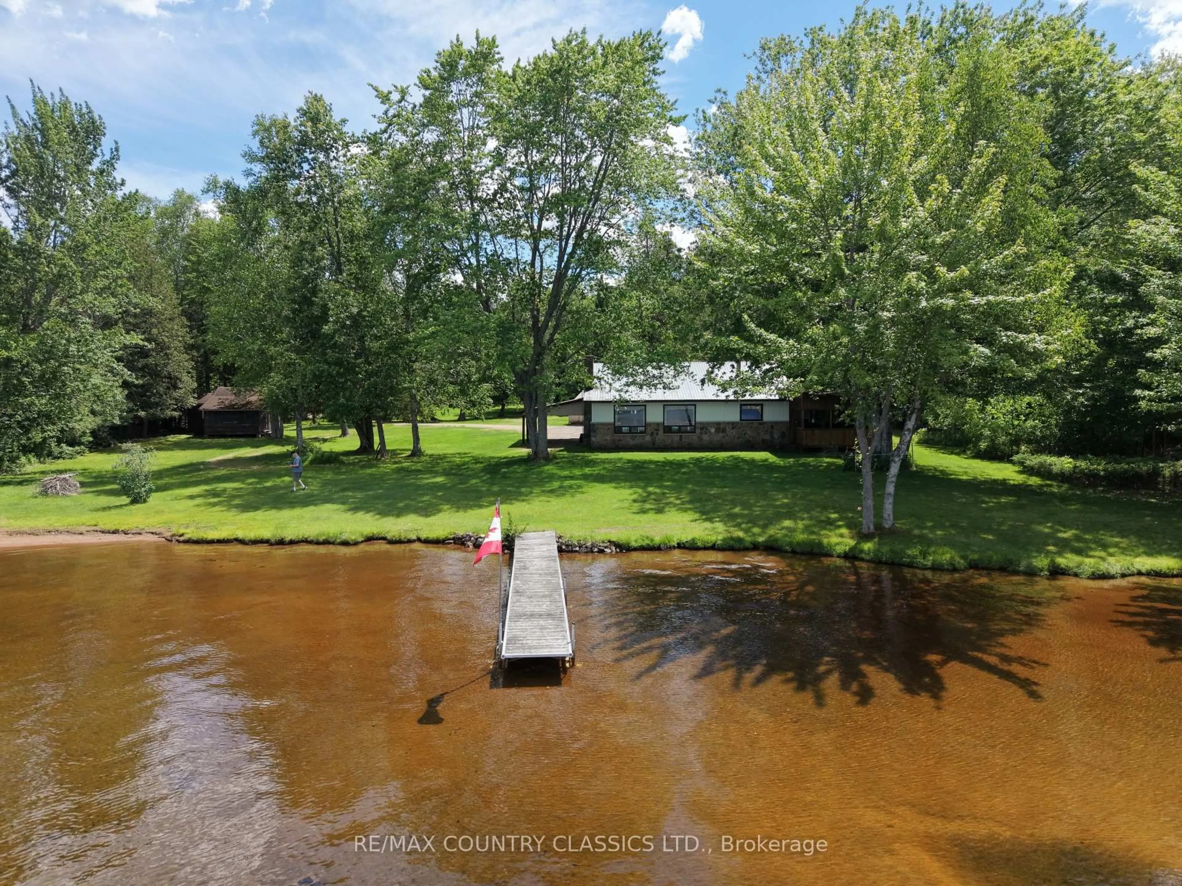 A pic from outside/outdoor area/front of a property/back of a property/a pic from drone, water/lake/river/ocean view for 107 Maika Rd, Combermere Ontario K0J 1L0
