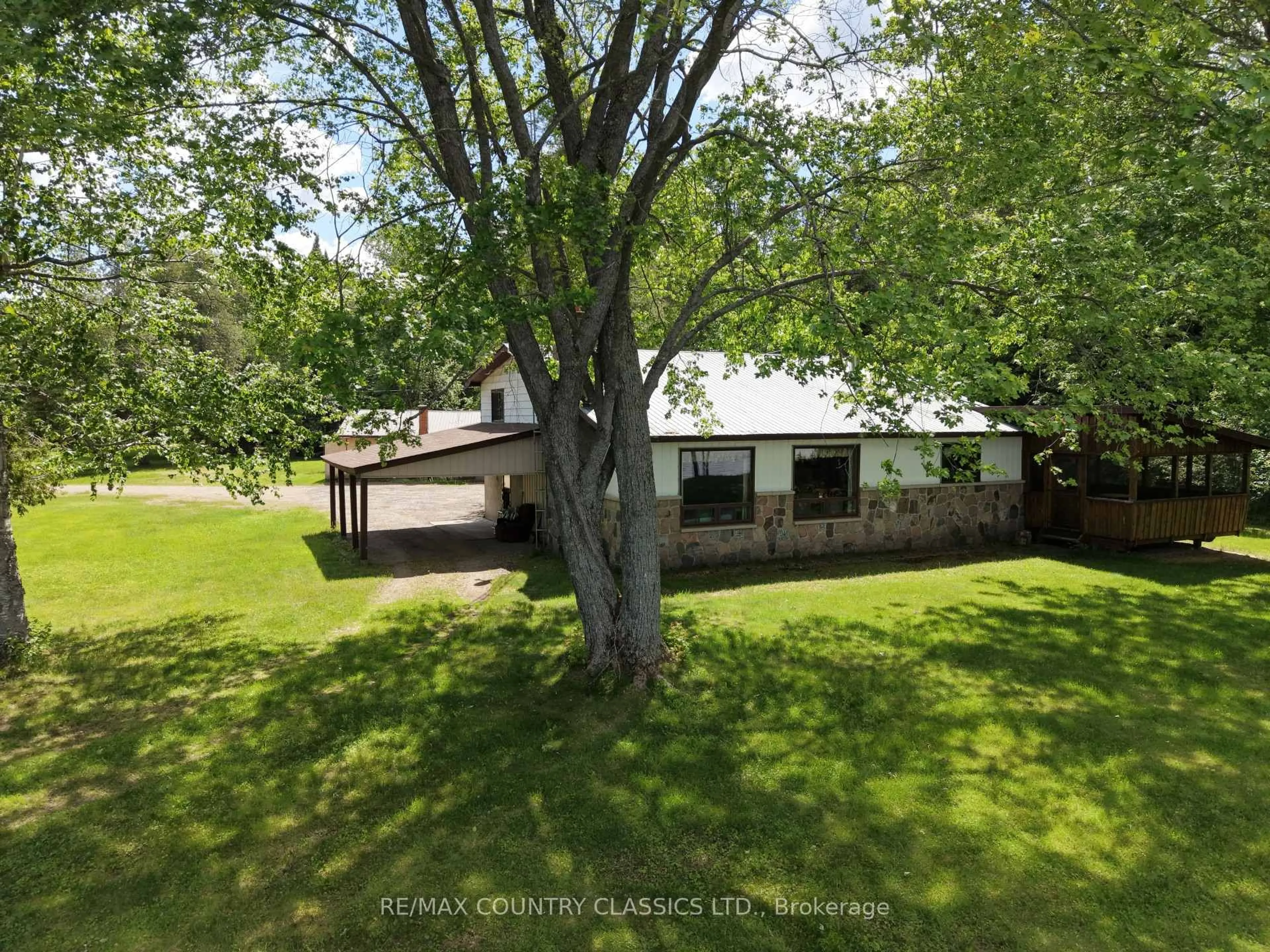 A pic from outside/outdoor area/front of a property/back of a property/a pic from drone, unknown for 107 Maika Rd, Combermere Ontario K0J 1L0