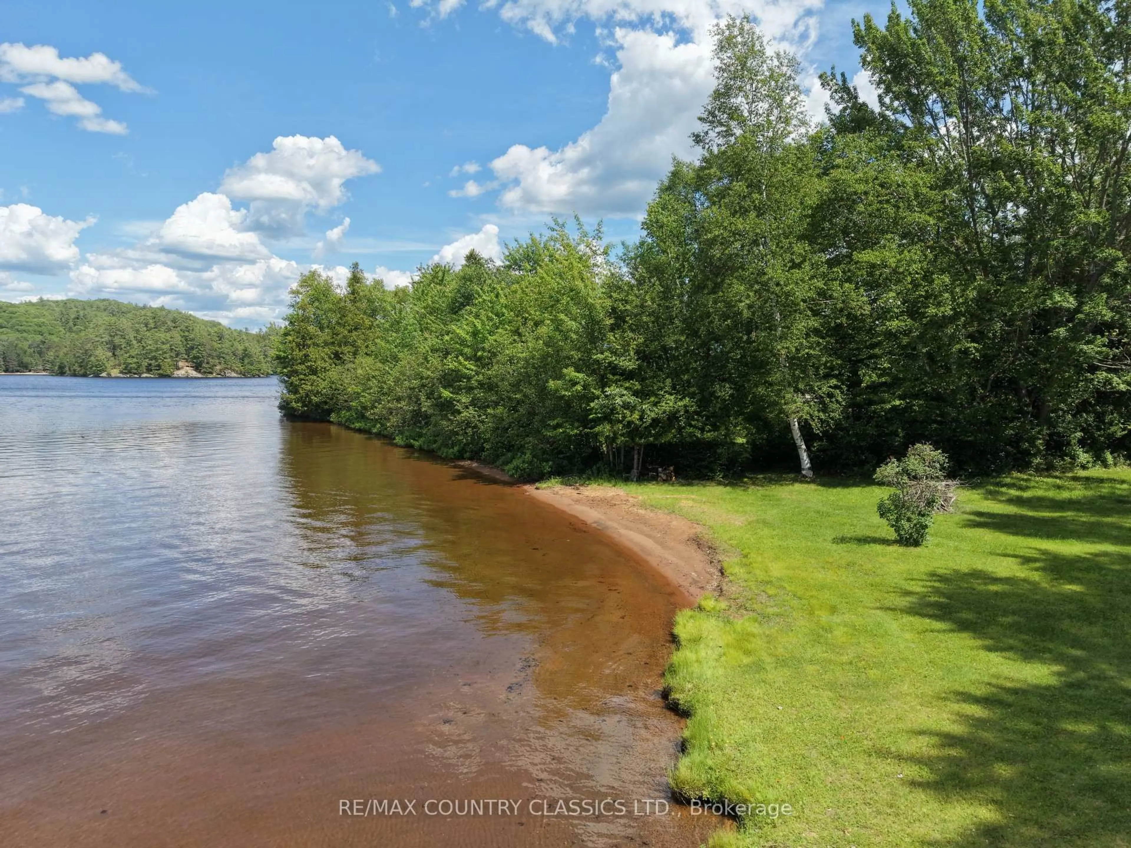 A pic from outside/outdoor area/front of a property/back of a property/a pic from drone, water/lake/river/ocean view for 107 Maika Rd, Combermere Ontario K0J 1L0
