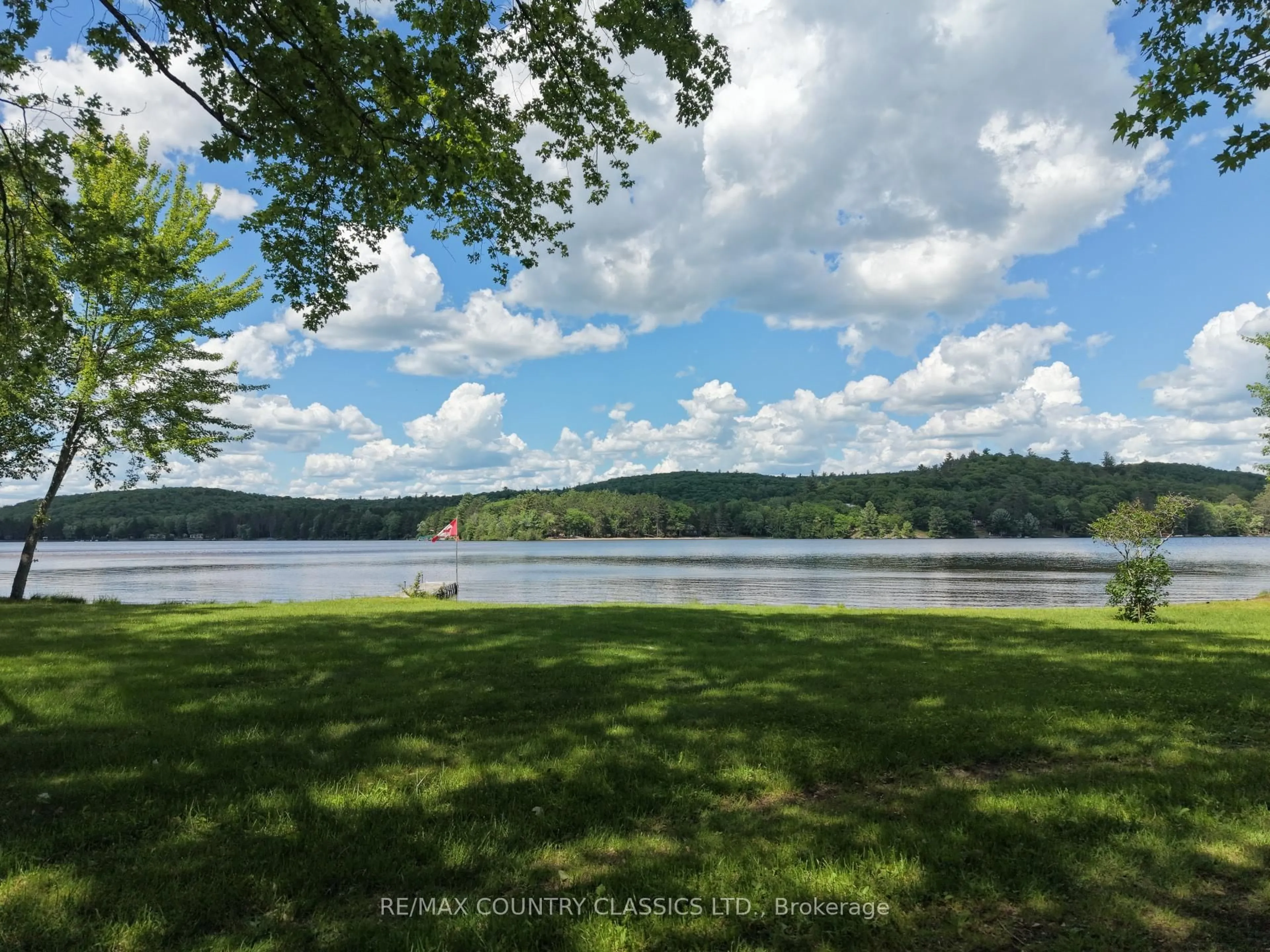 A pic from outside/outdoor area/front of a property/back of a property/a pic from drone, water/lake/river/ocean view for 107 Maika Rd, Combermere Ontario K0J 1L0