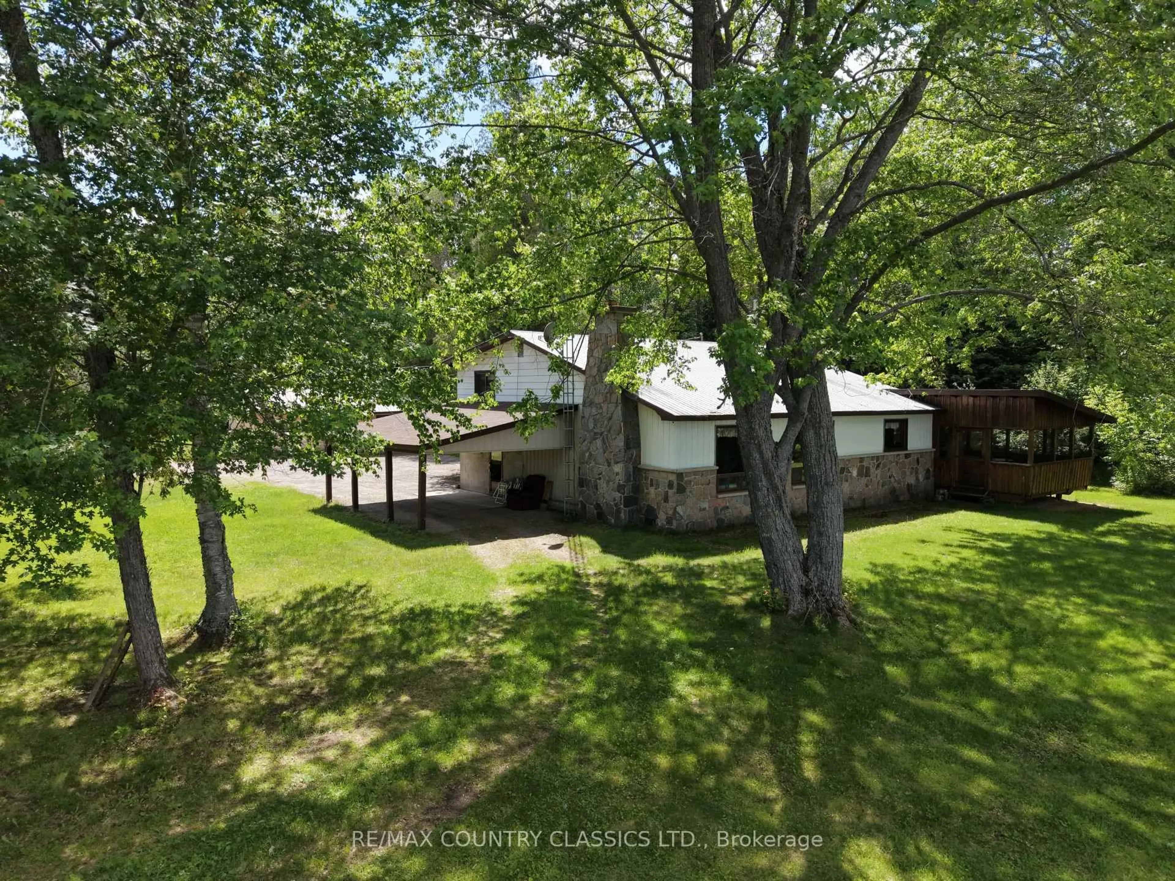 A pic from outside/outdoor area/front of a property/back of a property/a pic from drone, forest/trees view for 107 Maika Rd, Combermere Ontario K0J 1L0