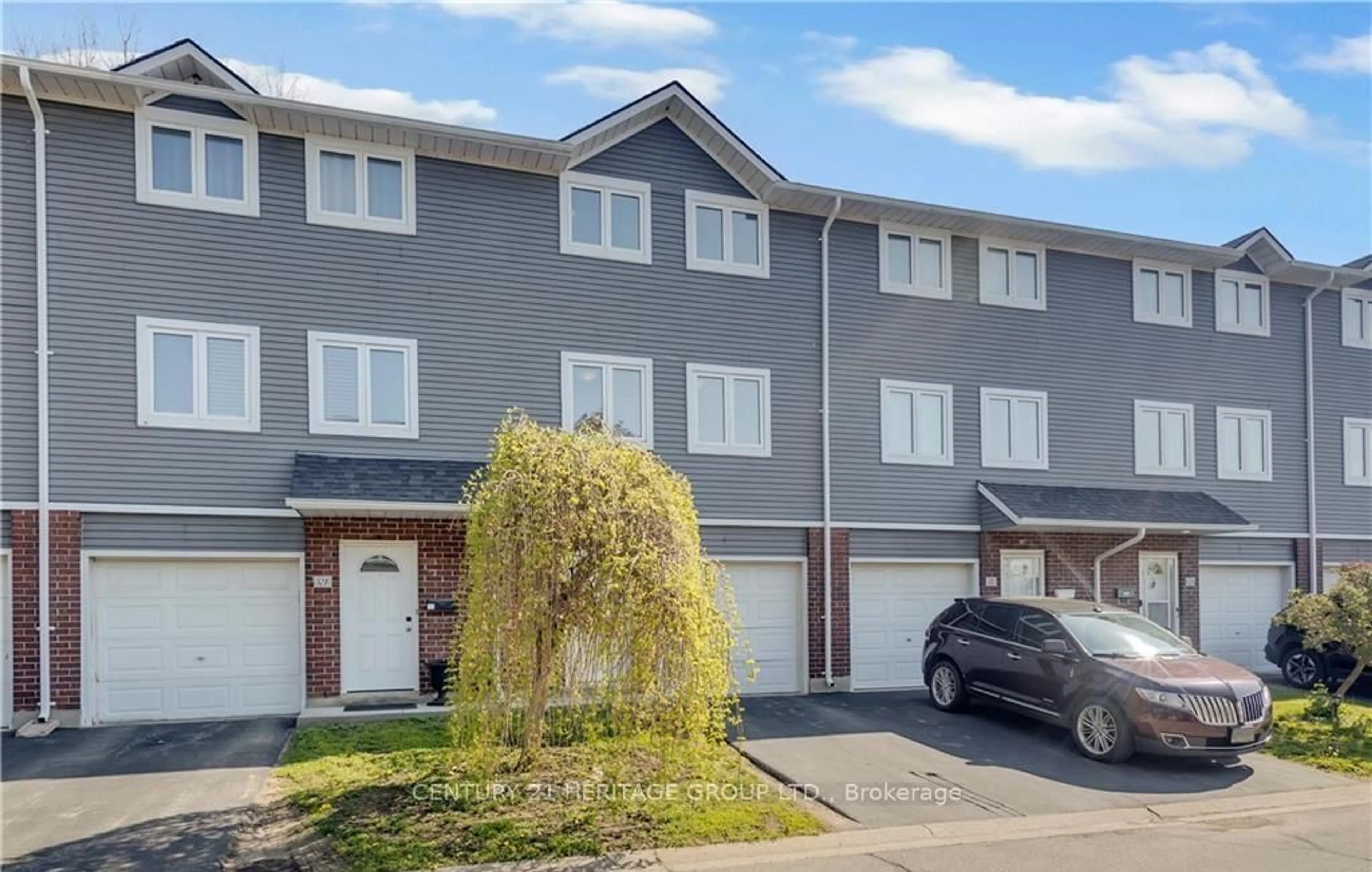 A pic from outside/outdoor area/front of a property/back of a property/a pic from drone, street for 52 Harris Ave #D, Brantford Ontario N3R 2E9