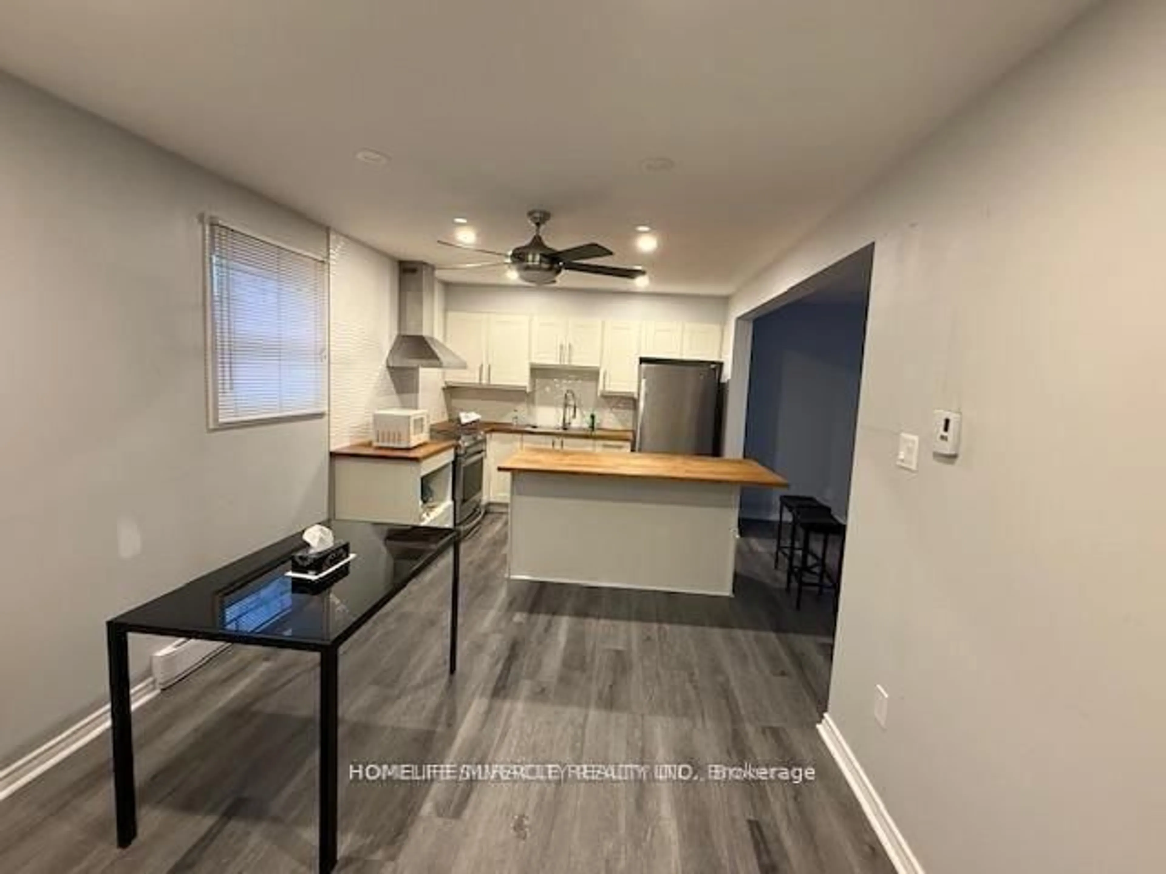 Open concept kitchen, wood/laminate floor for 860 Trafalgar St, London East Ontario N5Z 4W4