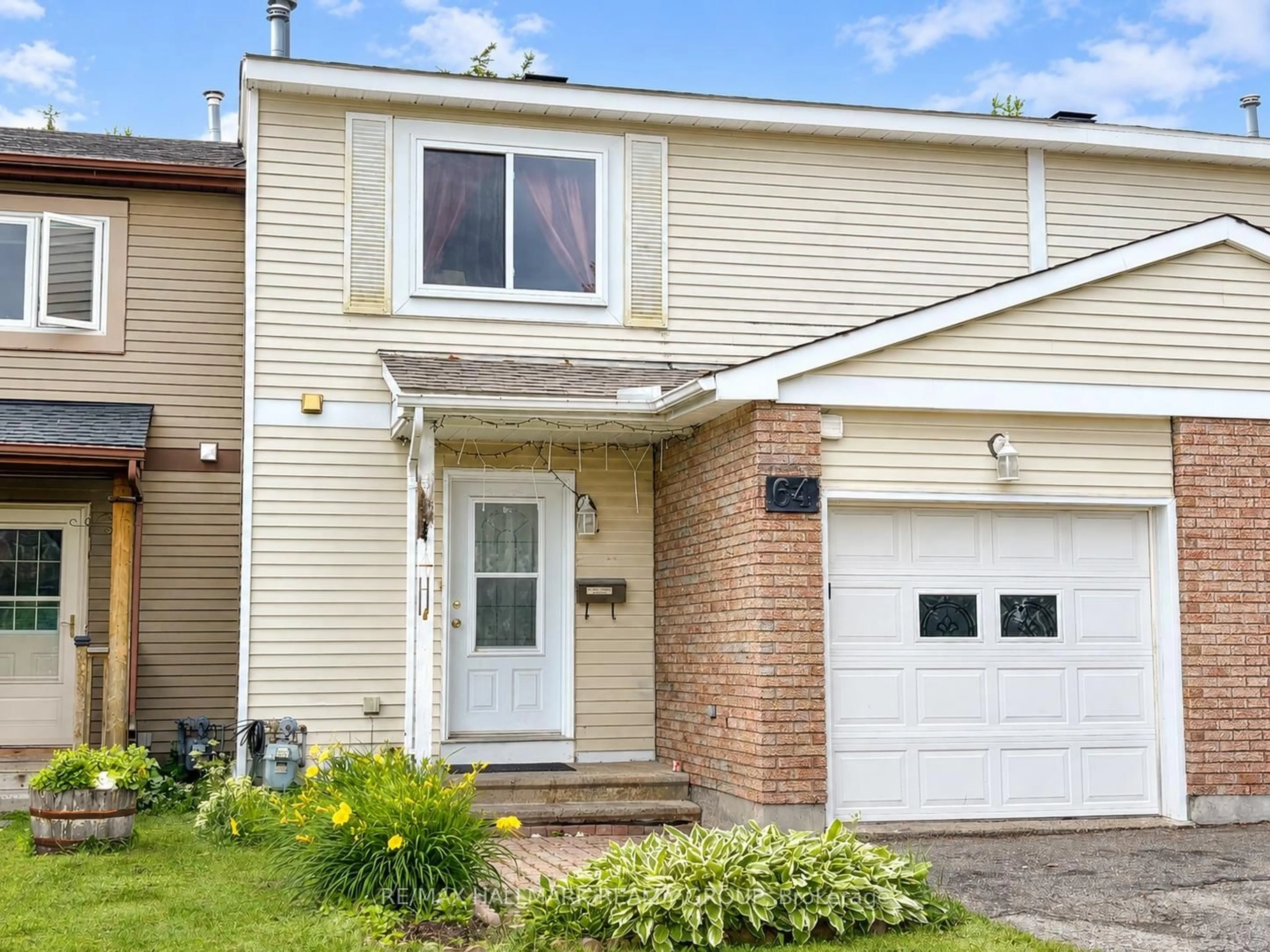 Home with vinyl exterior material, street for 64 EXETER Dr, Ottawa Ontario K2J 2E7