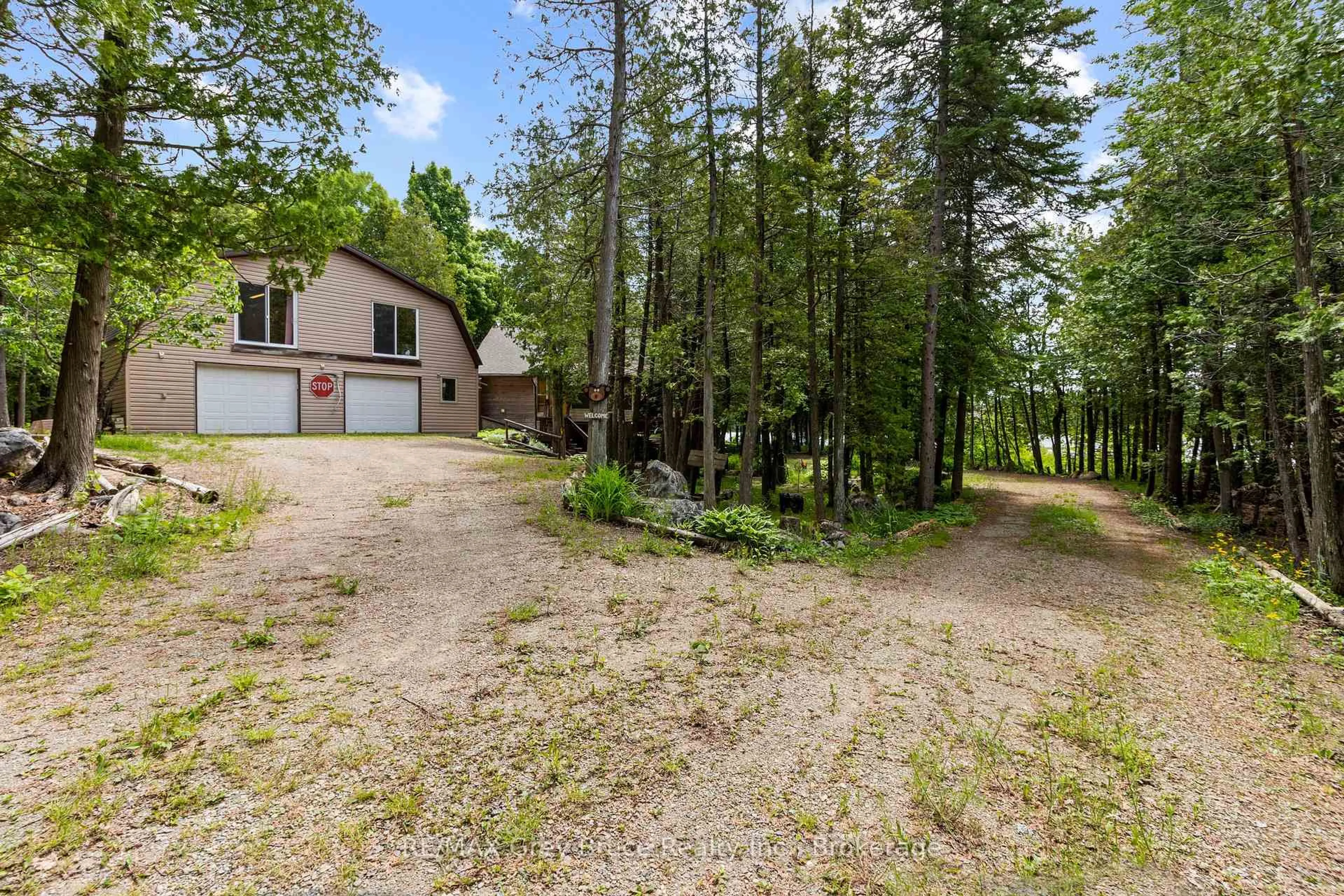 A pic from outside/outdoor area/front of a property/back of a property/a pic from drone, forest/trees view for 27 Hope Dr, Northern Bruce Peninsula Ontario N0H 1Z0