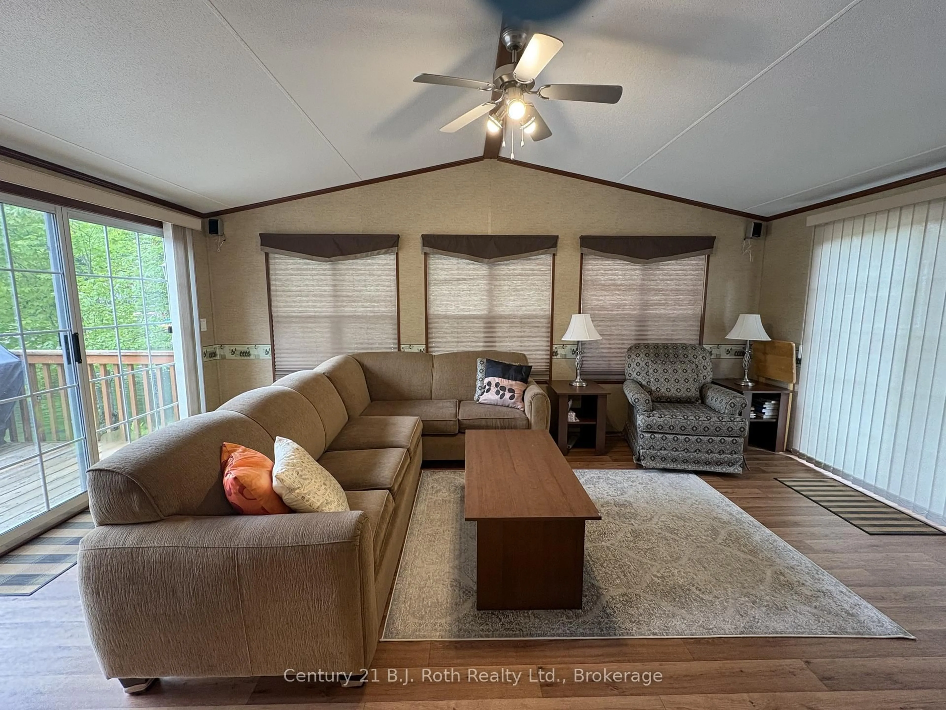 Living room with furniture, wood/laminate floor for 1336 South Morrison Lake Rd #4 Fernbrook, Gravenhurst Ontario P0E 1G0