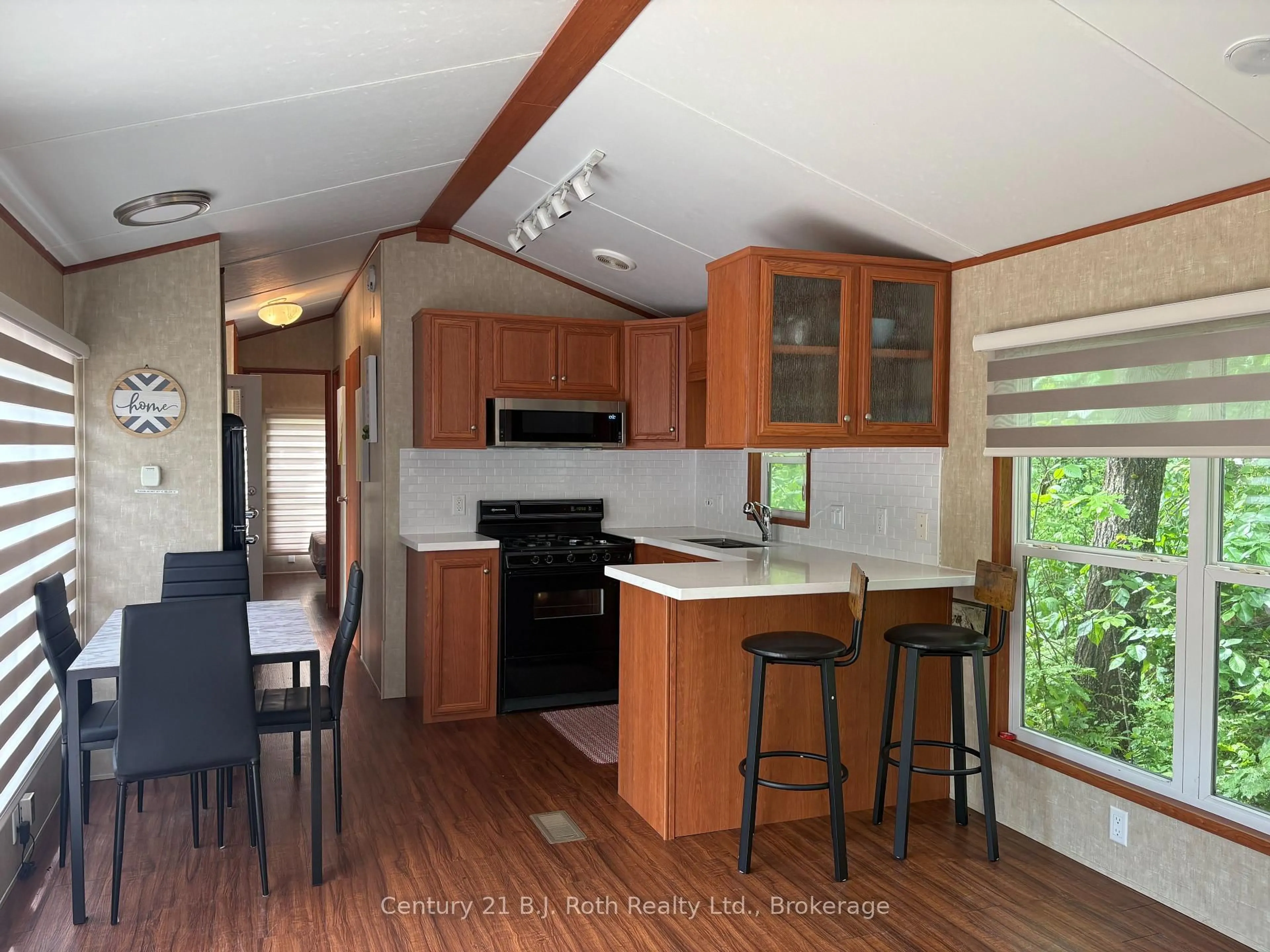 Open concept kitchen, wood/laminate floor for 1336 South Morrison Lake Rd #12 Morrison Creek, Gravenhurst Ontario P0E 1G0