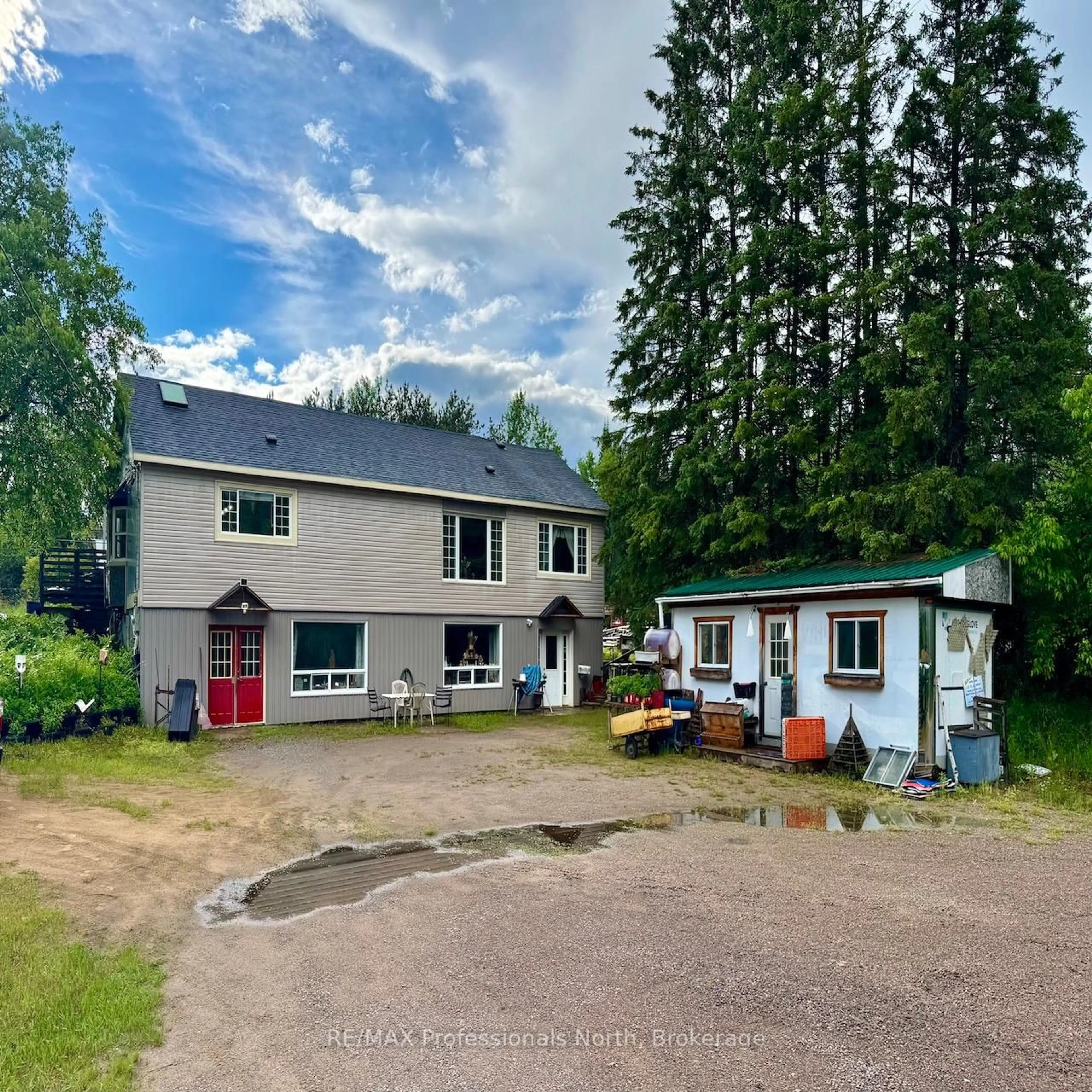 A pic from outside/outdoor area/front of a property/back of a property/a pic from drone, unknown for 7057 County Road 503, Minden Hills Ontario K0M 2A1