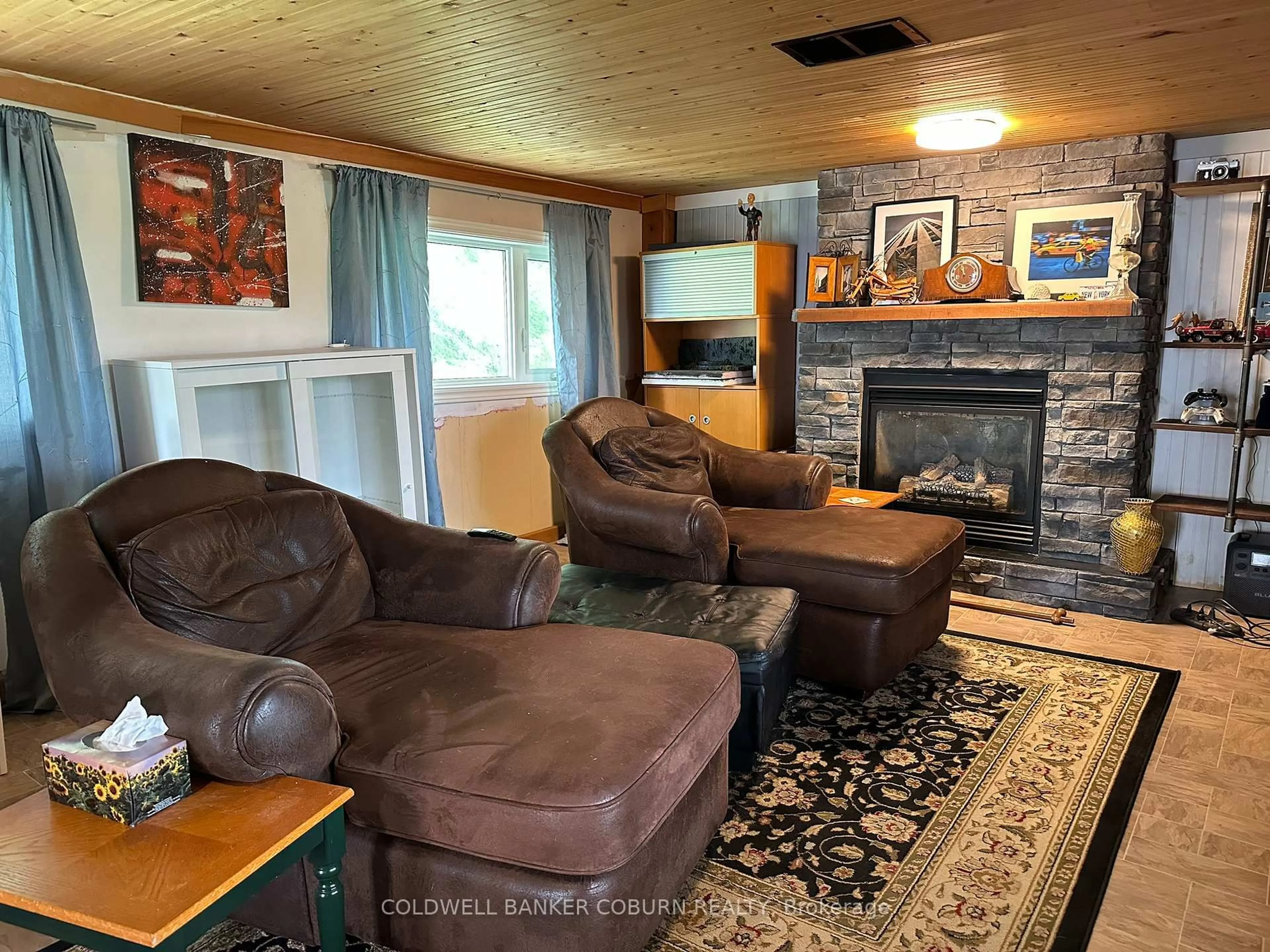 Living room with furniture, wood/laminate floor for 12169 Deeks Rd, South Dundas Ontario K0C 1X0