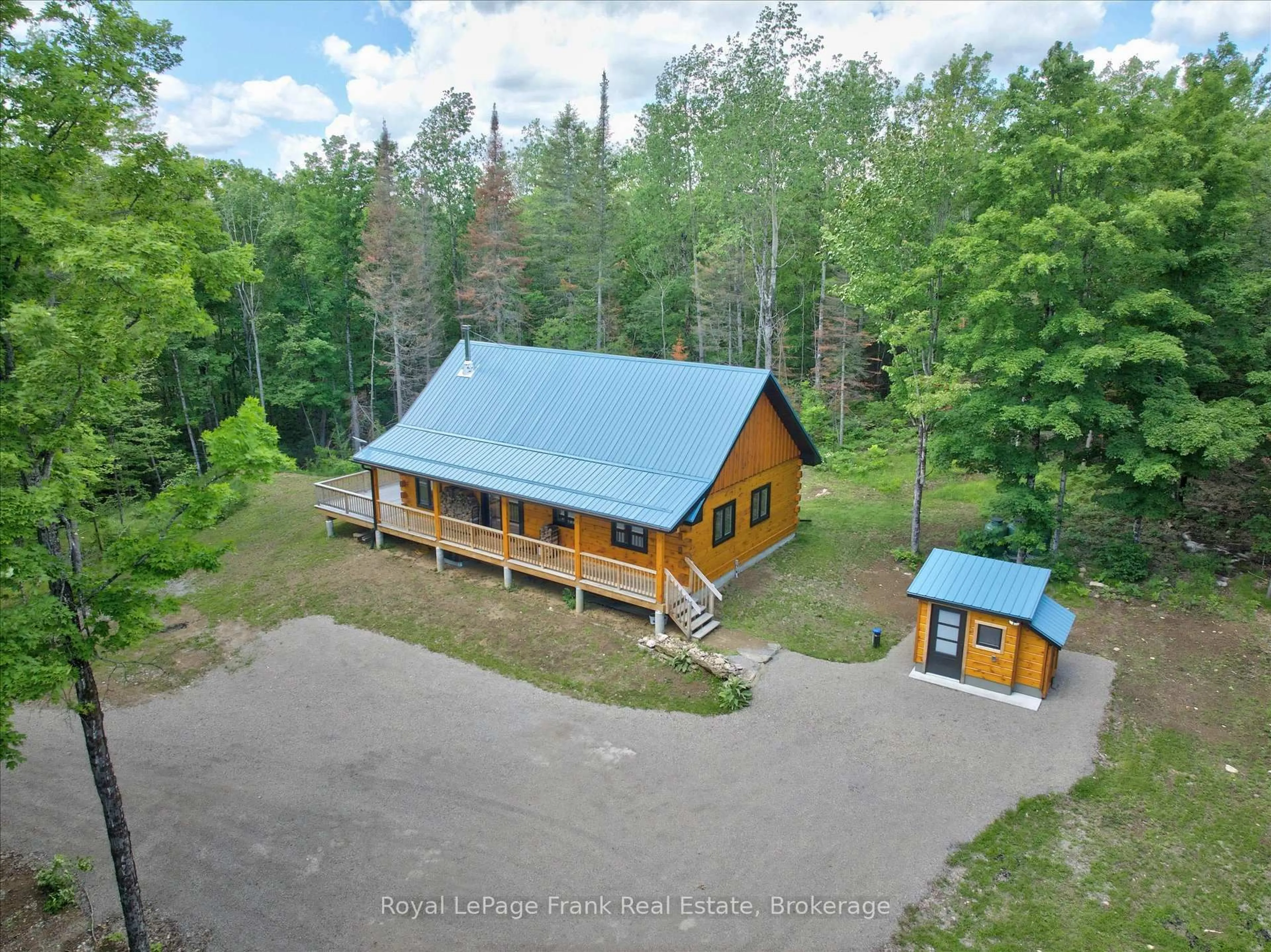 A pic from outside/outdoor area/front of a property/back of a property/a pic from drone, unknown for 413 West Bay Rd, North Kawartha Ontario K0L 1A0