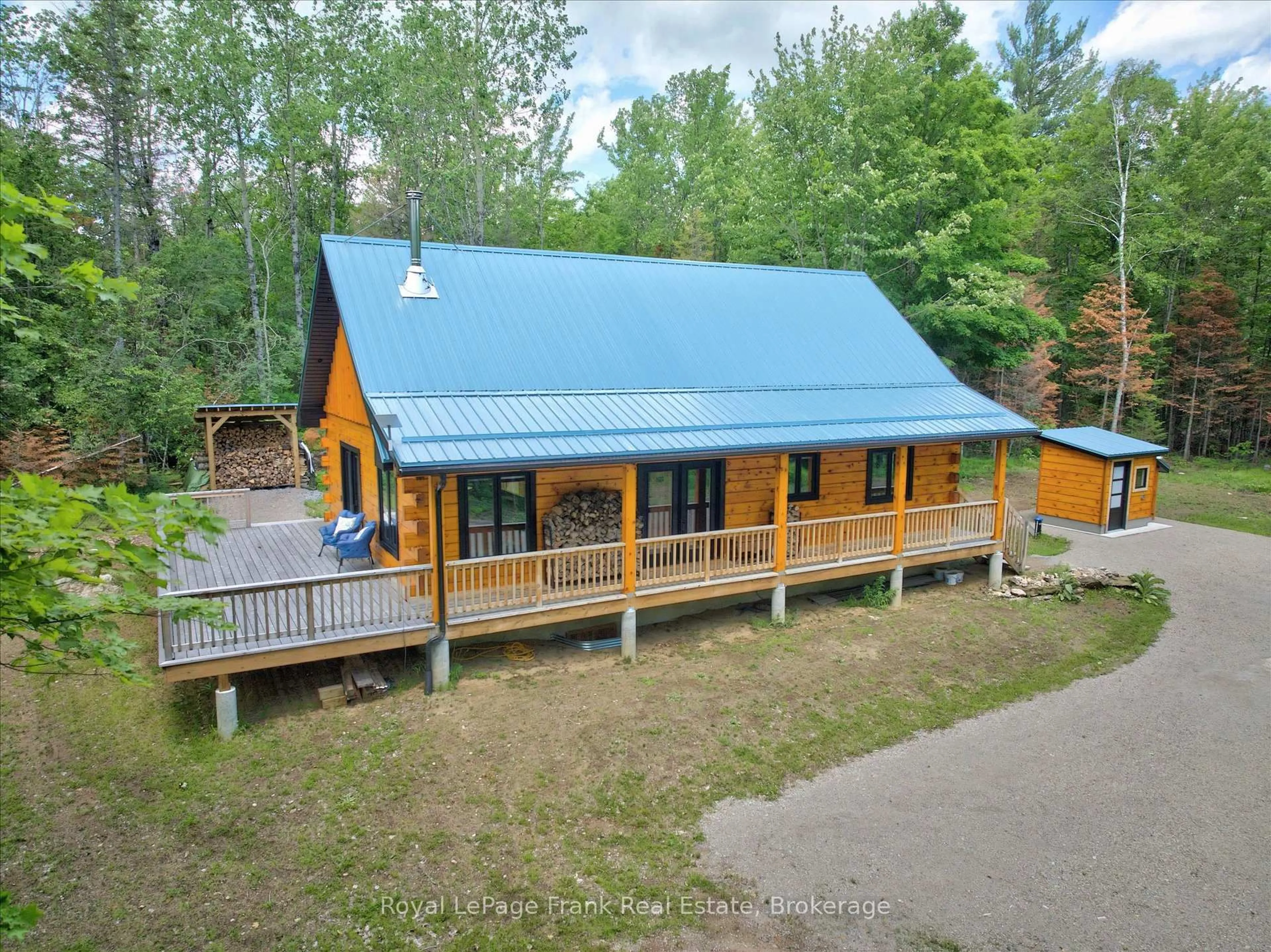 A pic from outside/outdoor area/front of a property/back of a property/a pic from drone, unknown for 413 West Bay Rd, North Kawartha Ontario K0L 1A0