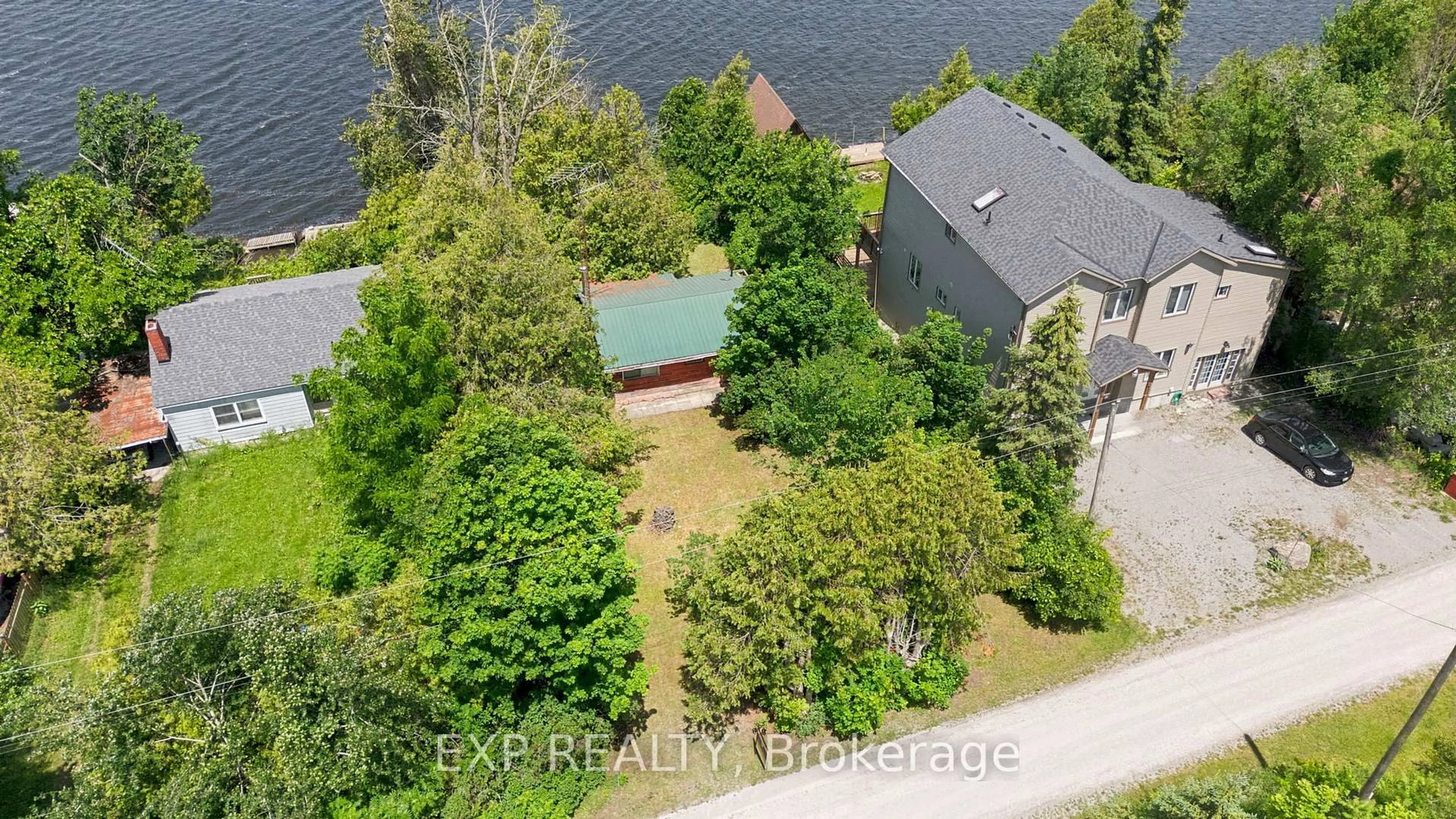 A pic from outside/outdoor area/front of a property/back of a property/a pic from drone, water/lake/river/ocean view for 61 North Taylor Rd, Kawartha Lakes Ontario K0M 2B0