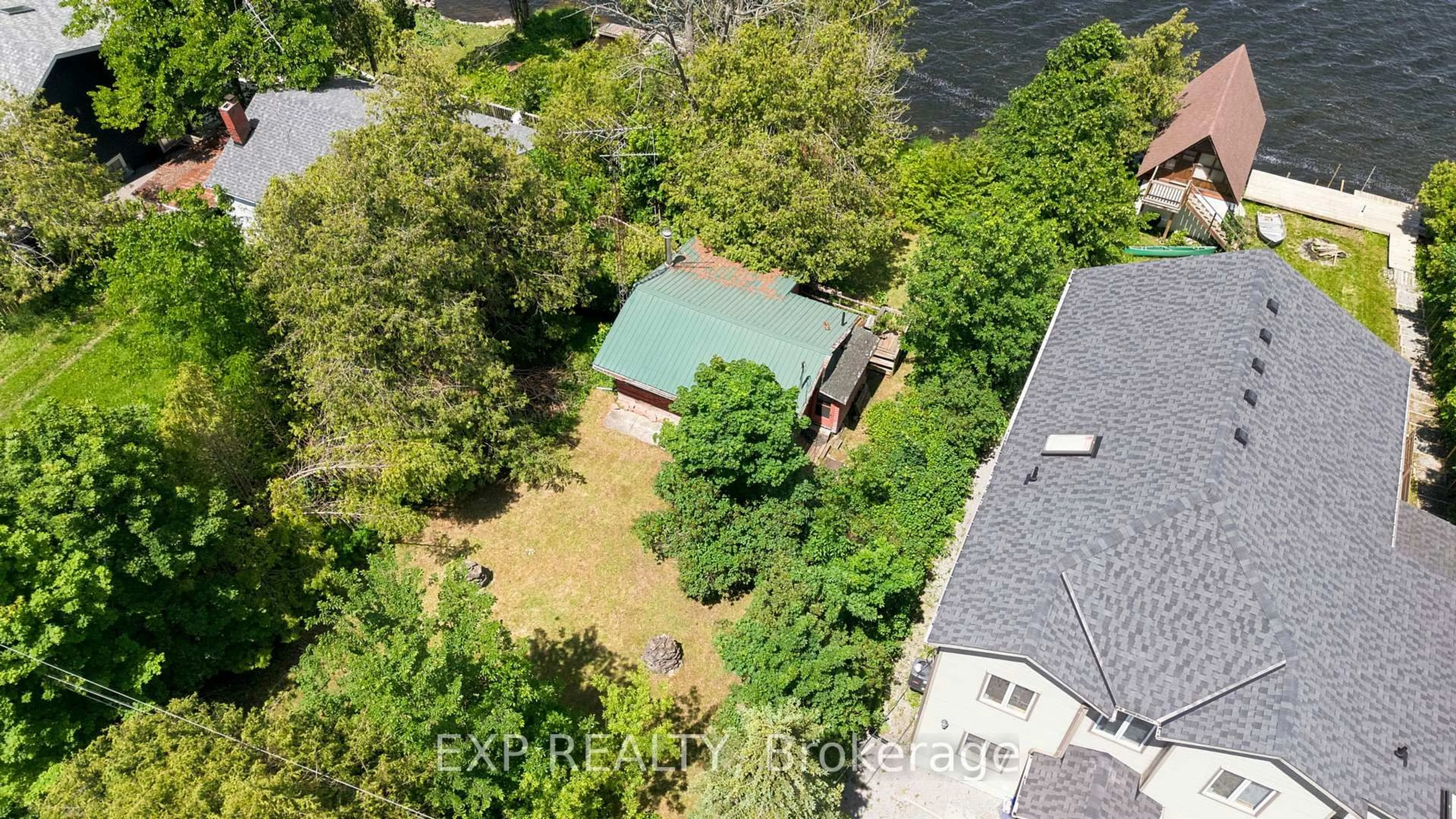 A pic from outside/outdoor area/front of a property/back of a property/a pic from drone, unknown for 61 North Taylor Rd, Kawartha Lakes Ontario K0M 2B0