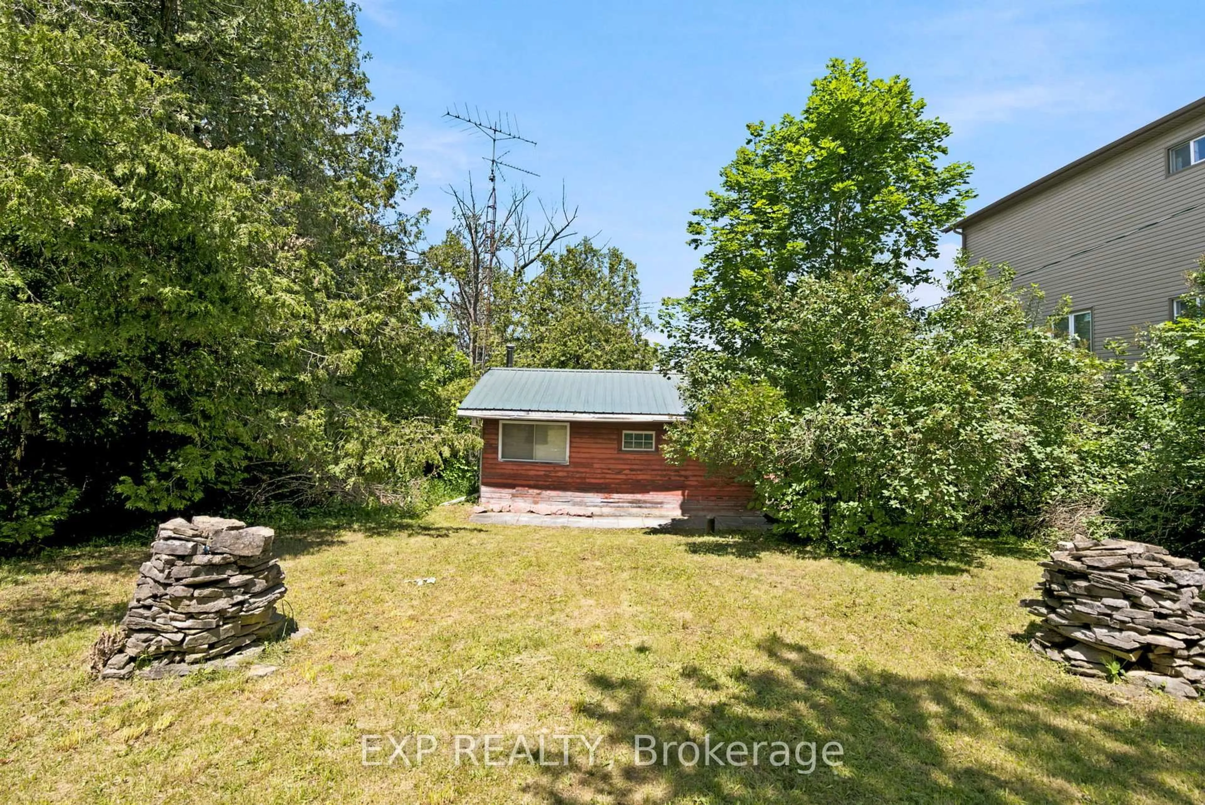 A pic from outside/outdoor area/front of a property/back of a property/a pic from drone, forest/trees view for 61 North Taylor Rd, Kawartha Lakes Ontario K0M 2B0