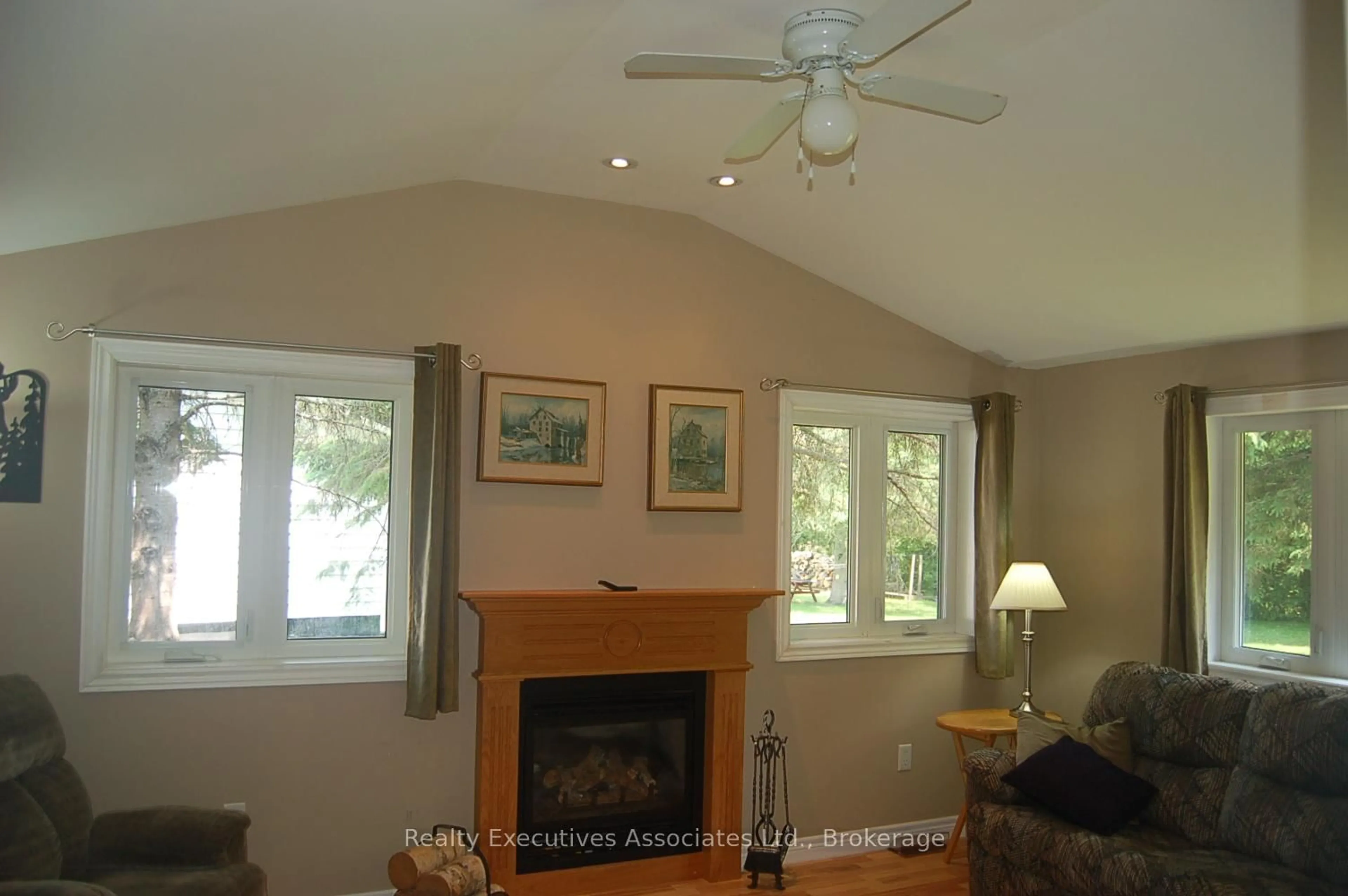 Living room with furniture, wood/laminate floor for 211 Alpine Lake Rd, Trent Lakes Ontario K0M 1A0