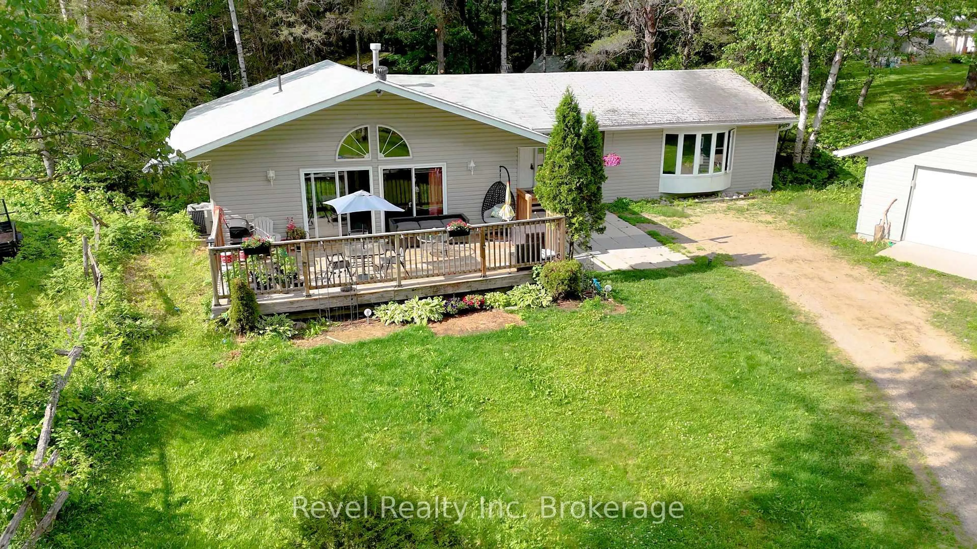 A pic from outside/outdoor area/front of a property/back of a property/a pic from drone, water/lake/river/ocean view for 36 Tebby Blvd, South River Ontario P0A 1X0