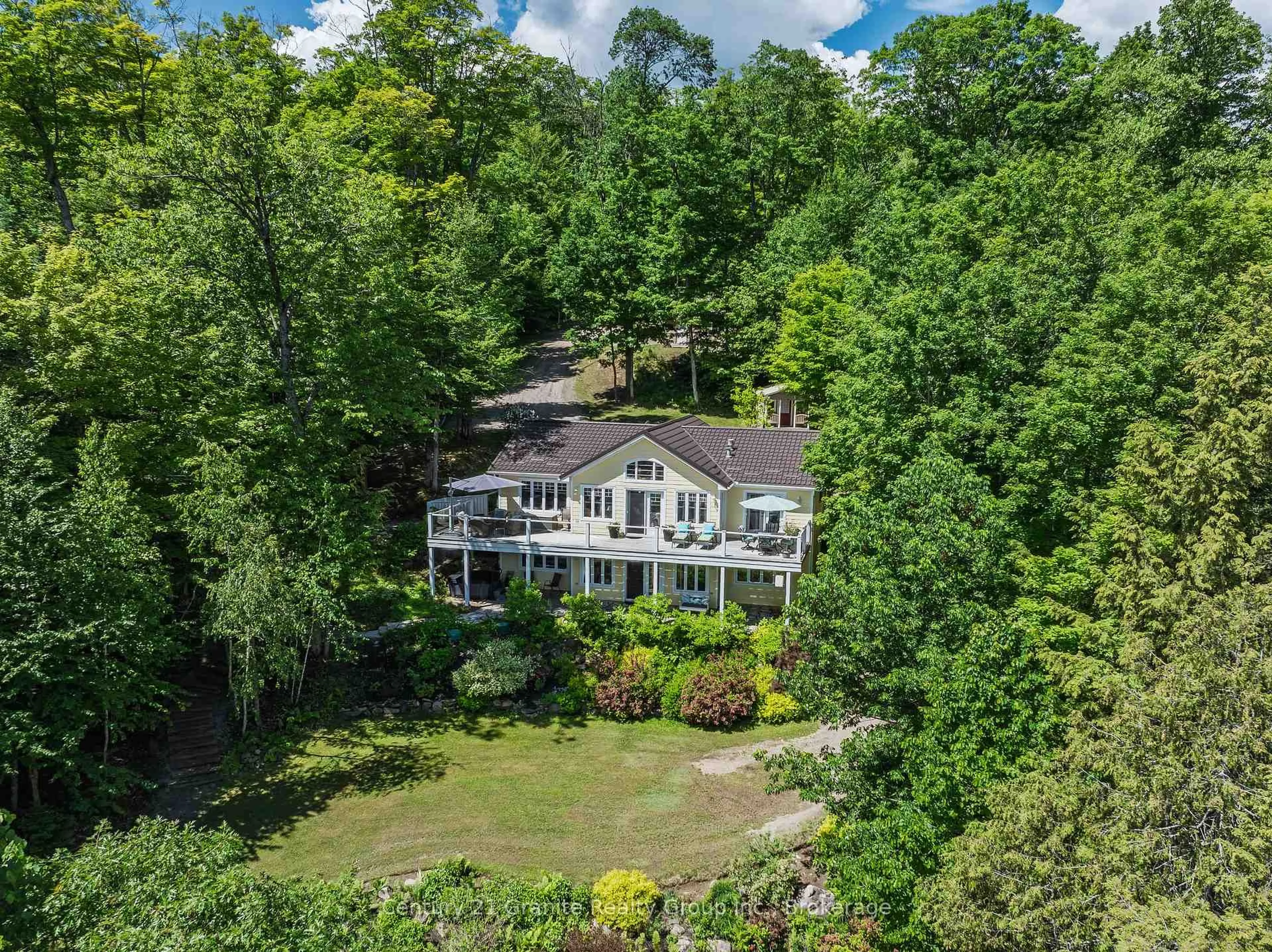 A pic from outside/outdoor area/front of a property/back of a property/a pic from drone, water/lake/river/ocean view for 1070 Shipley Dr, Minden Hills Ontario K0M 1S0