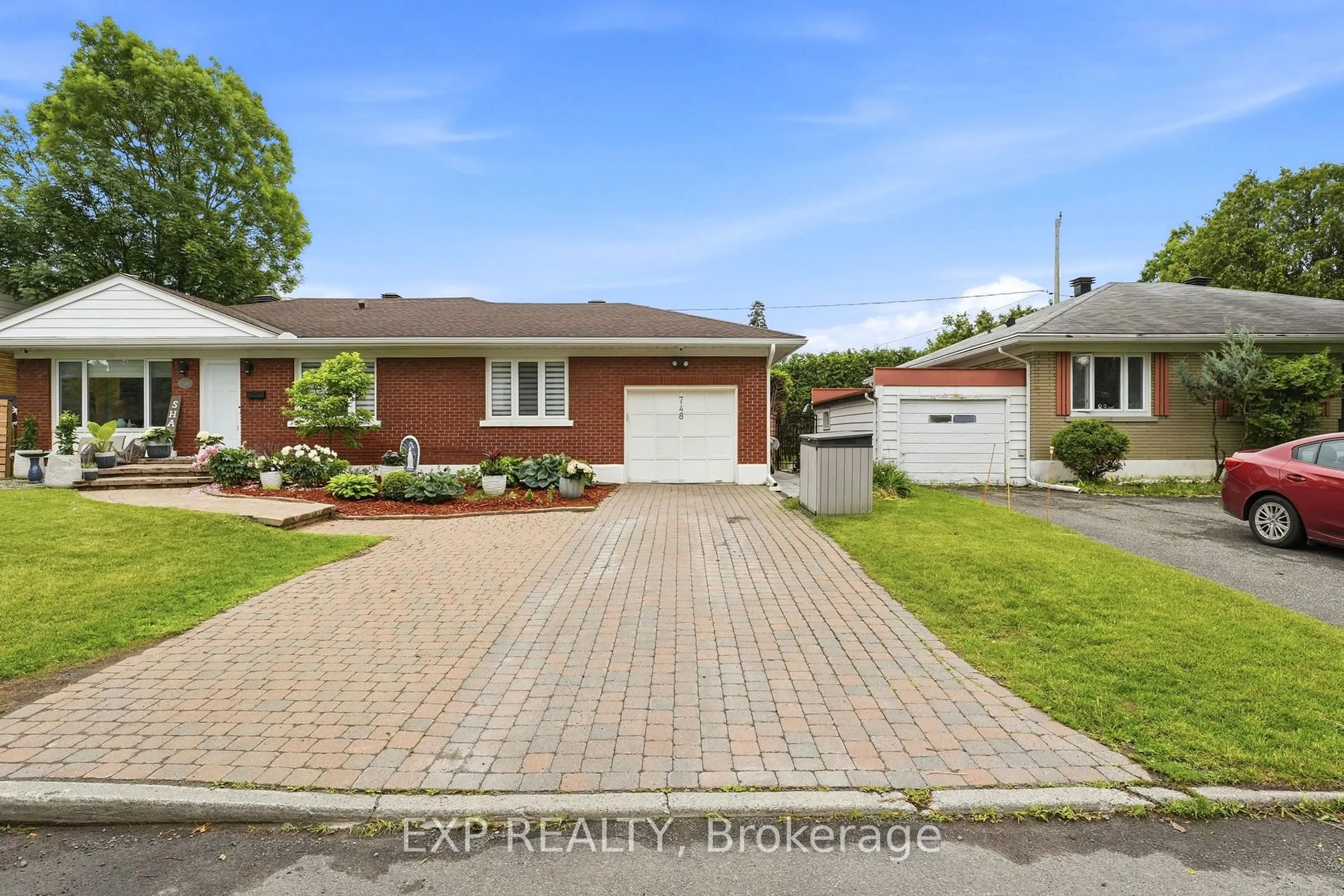 Home with brick exterior material, street for 748 WESTON Dr, Ottawa Ontario K1G 1W2