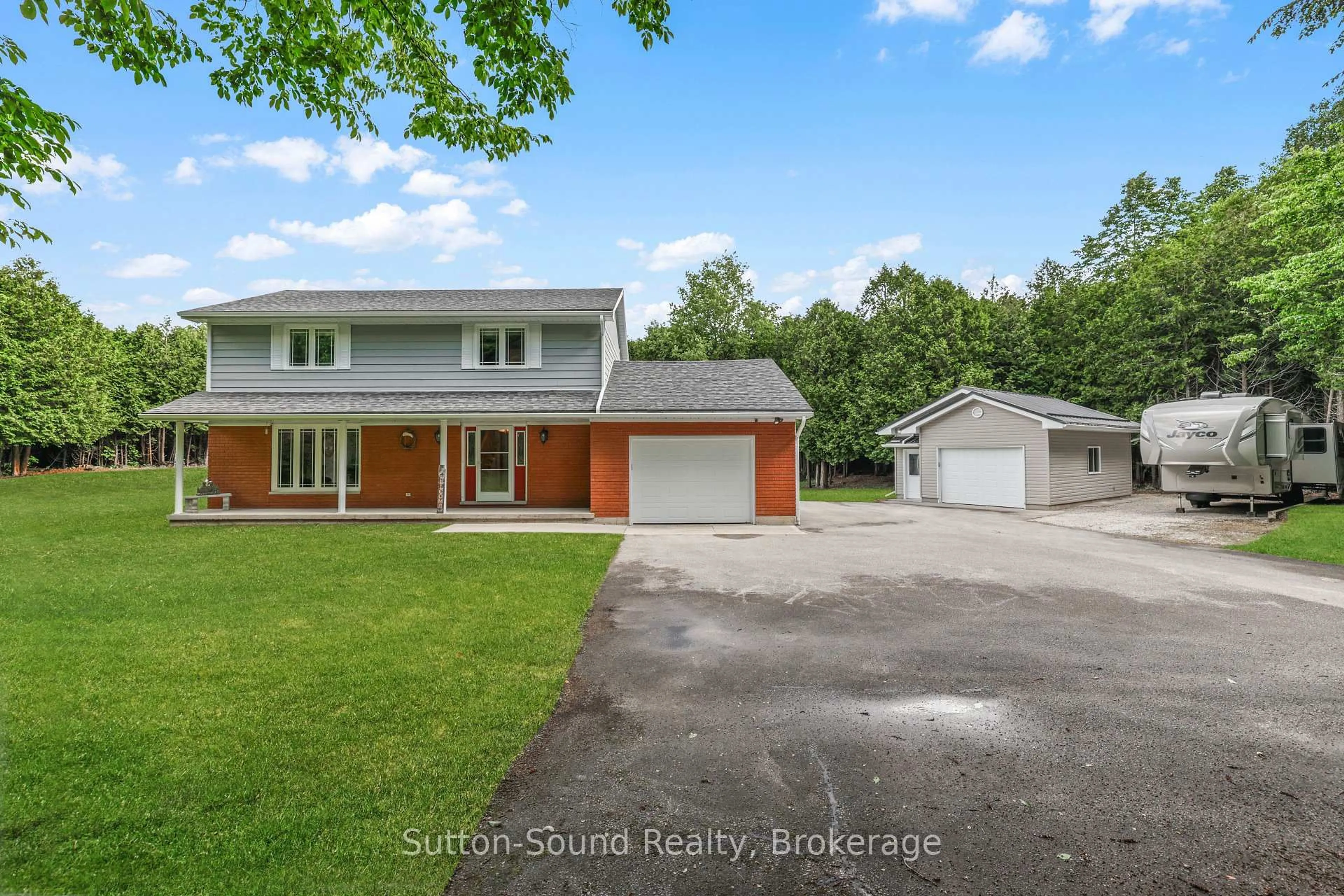 A pic from outside/outdoor area/front of a property/back of a property/a pic from drone, street for 200065 10 Sdrd, Georgian Bluffs Ontario N0H 2K0