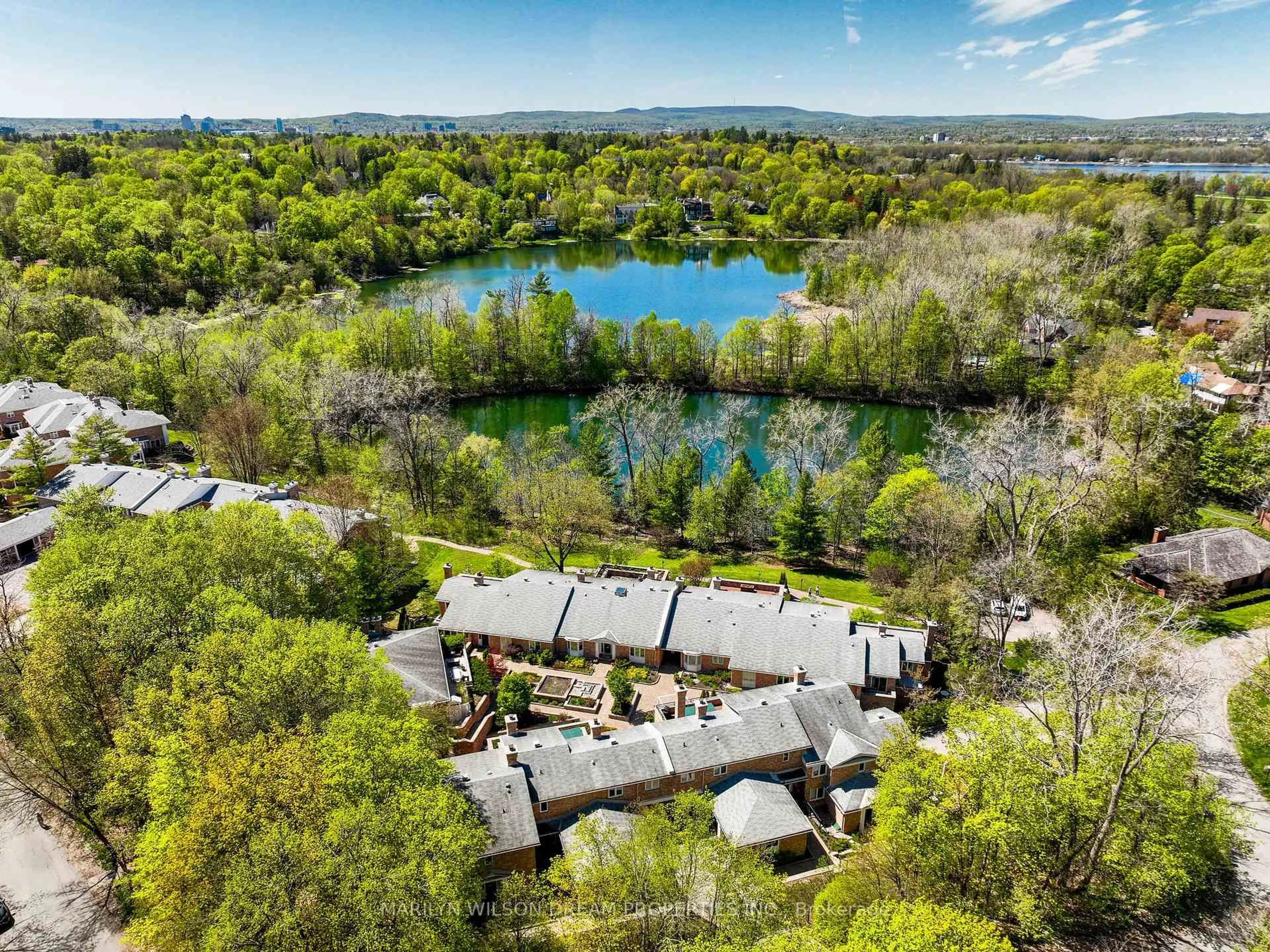 A pic from outside/outdoor area/front of a property/back of a property/a pic from drone, water/lake/river/ocean view for 65 Whitemarl Dr #6, Ottawa Ontario K1L 8J9