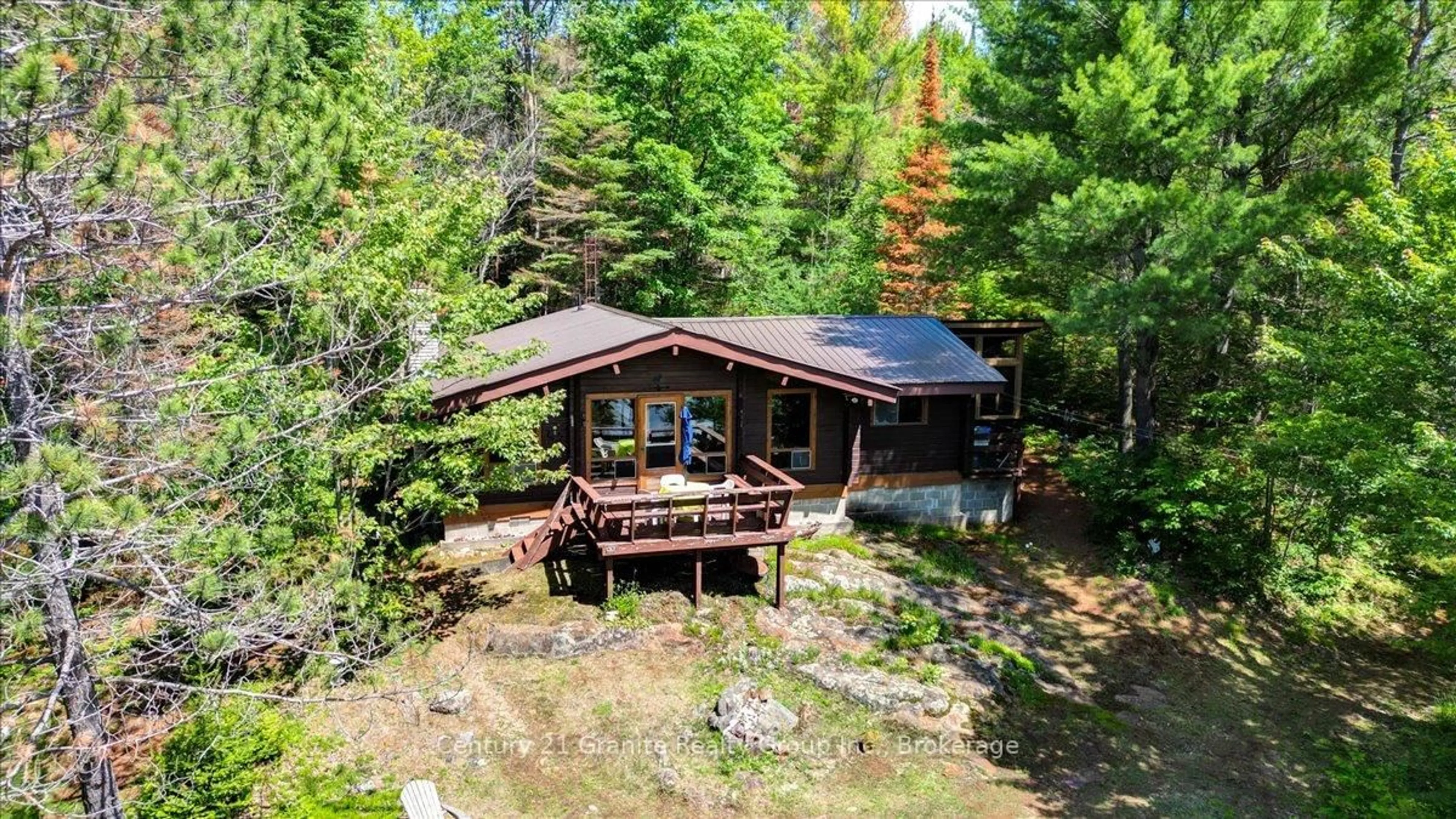A pic from outside/outdoor area/front of a property/back of a property/a pic from drone, water/lake/river/ocean view for 24224 62 Highway, Coe Hill Ontario K0L 1P0