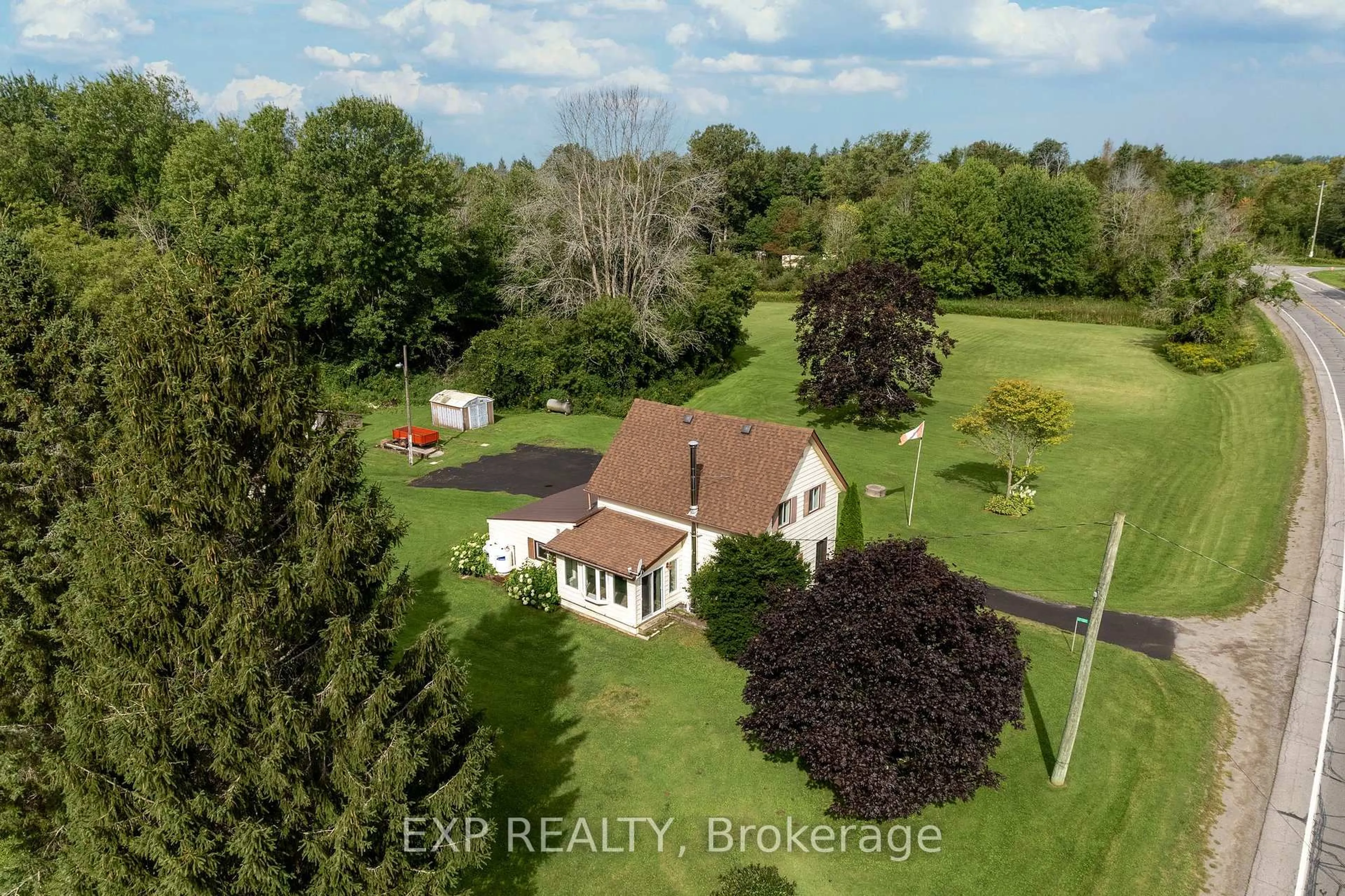 A pic from outside/outdoor area/front of a property/back of a property/a pic from drone, water/lake/river/ocean view for 21331 Loyalist Pkwy, Prince Edward County Ontario K0K 1L0