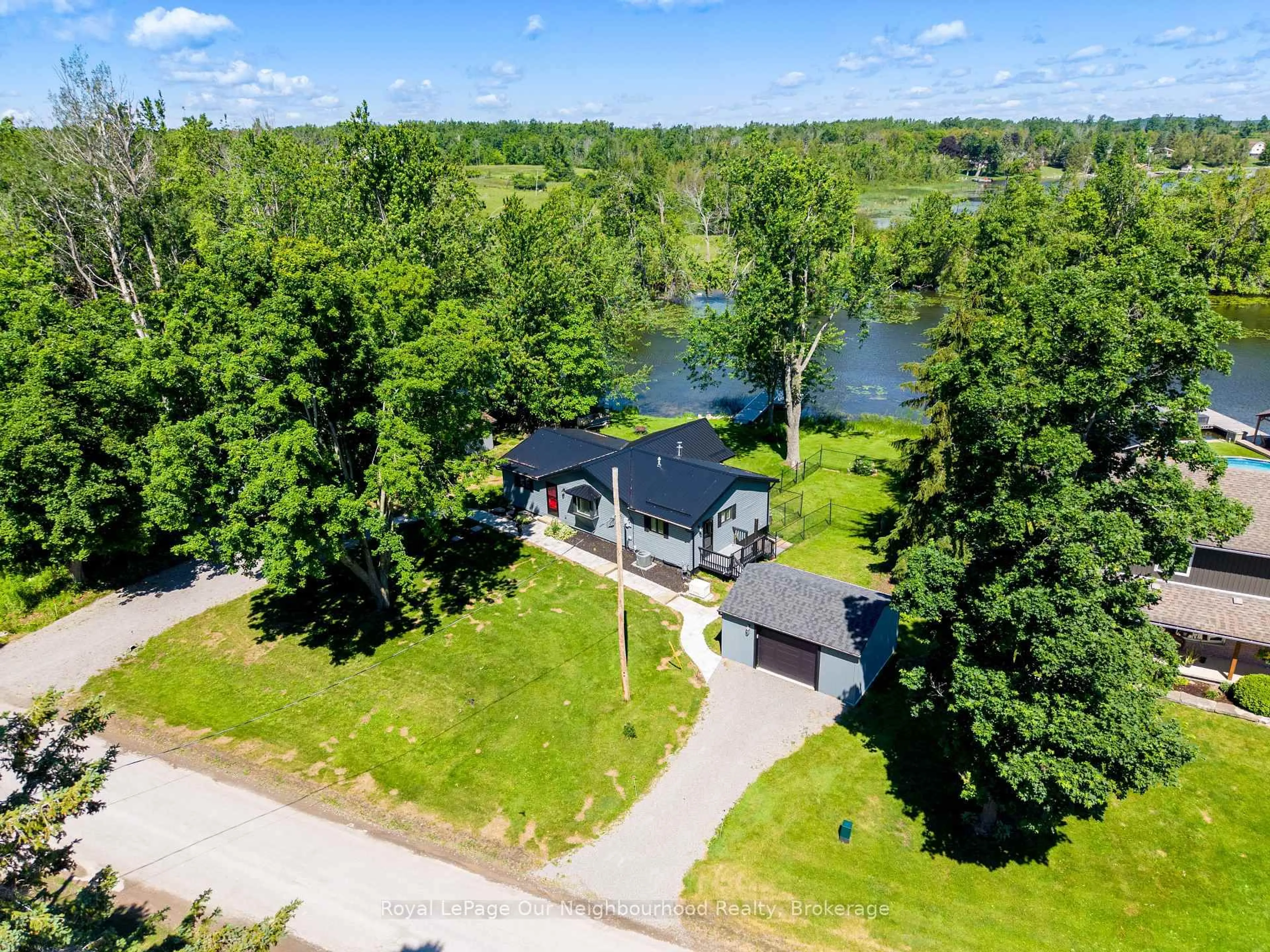 A pic from outside/outdoor area/front of a property/back of a property/a pic from drone, water/lake/river/ocean view for 1194 Nuforest Dr, Selwyn Ontario K0L 1T0