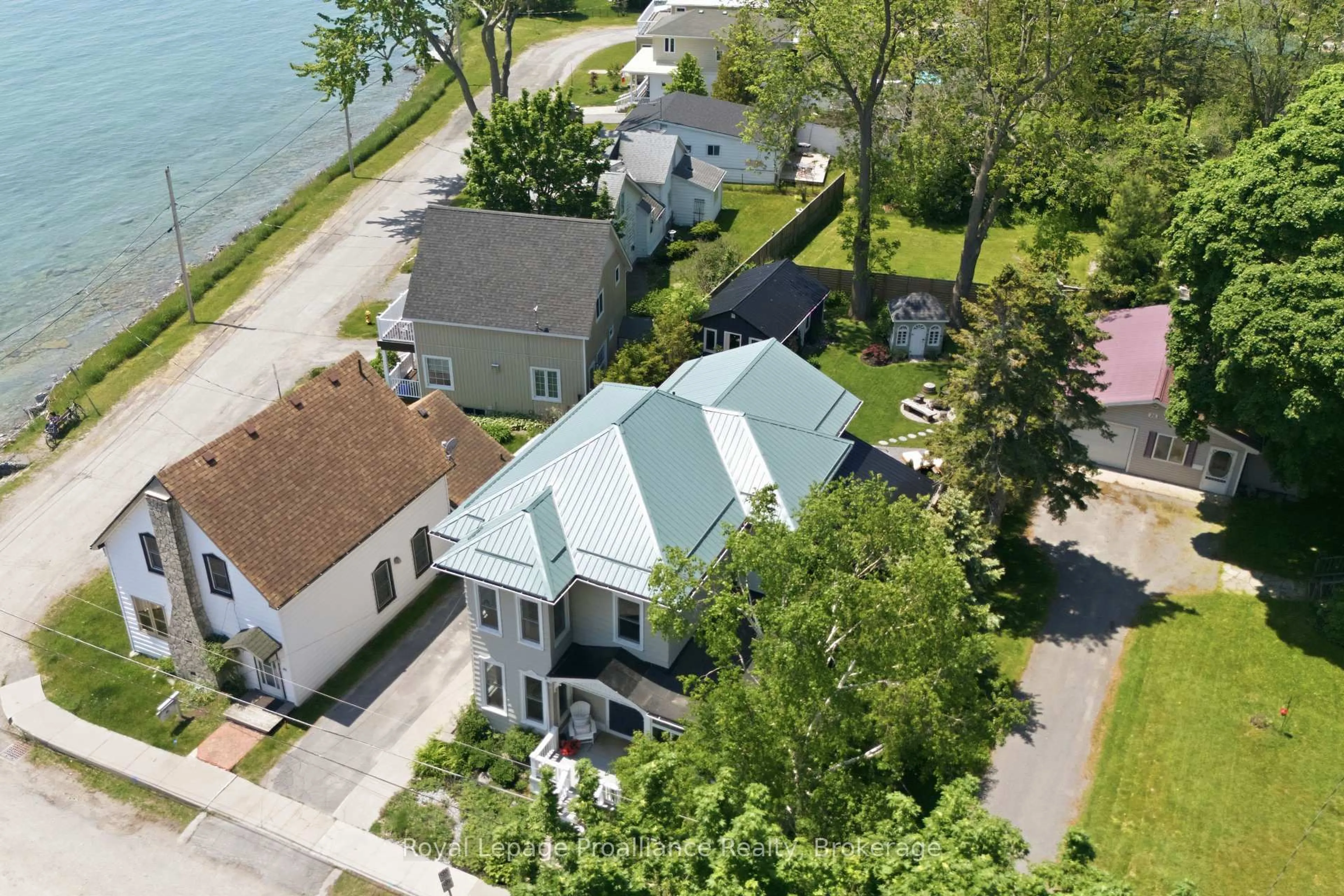 A pic from outside/outdoor area/front of a property/back of a property/a pic from drone, water/lake/river/ocean view for 22 West St, Prince Edward County Ontario K0K 3L0